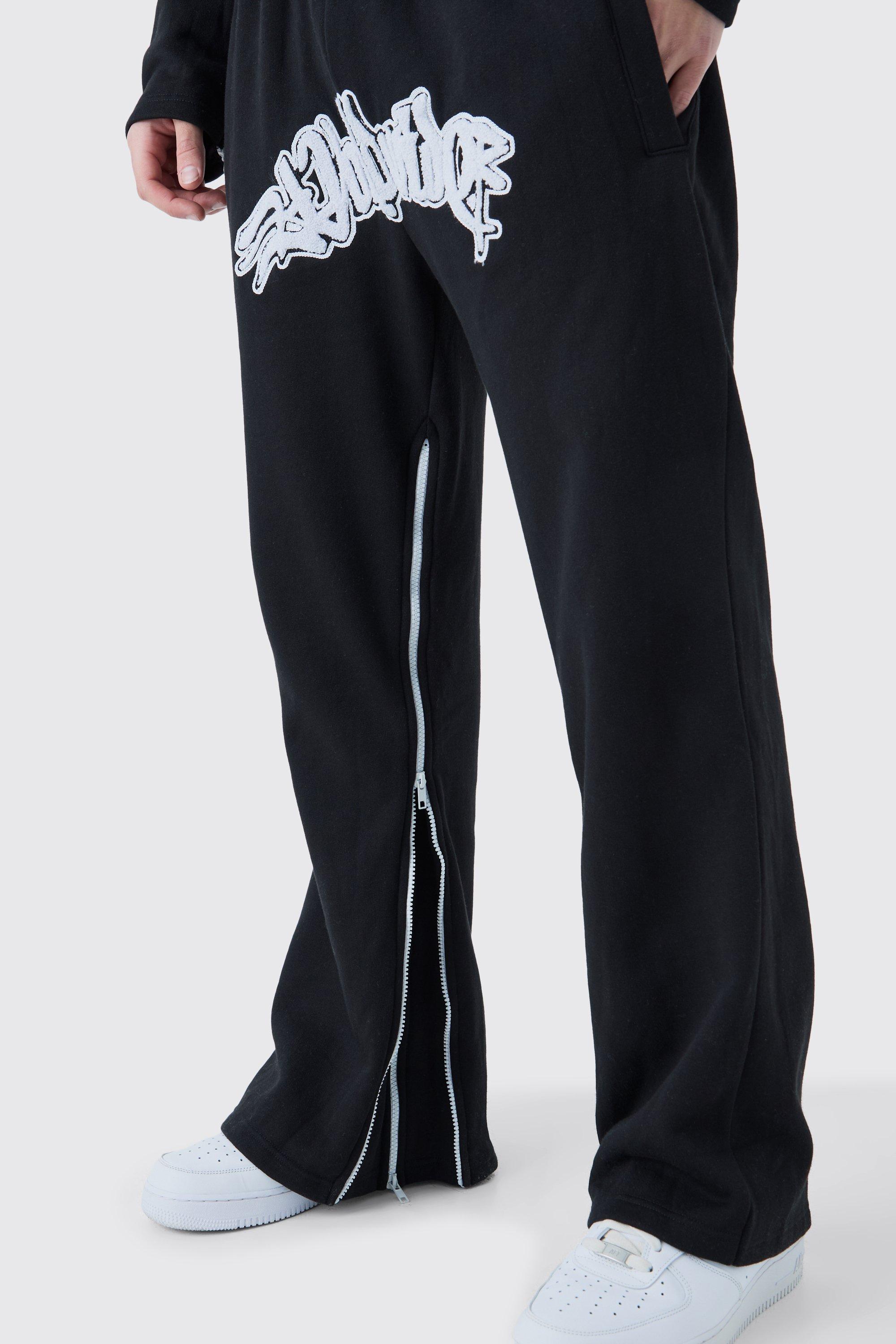 Image of Pantaloni tuta Worldwide con inserti, applique e zip, Nero