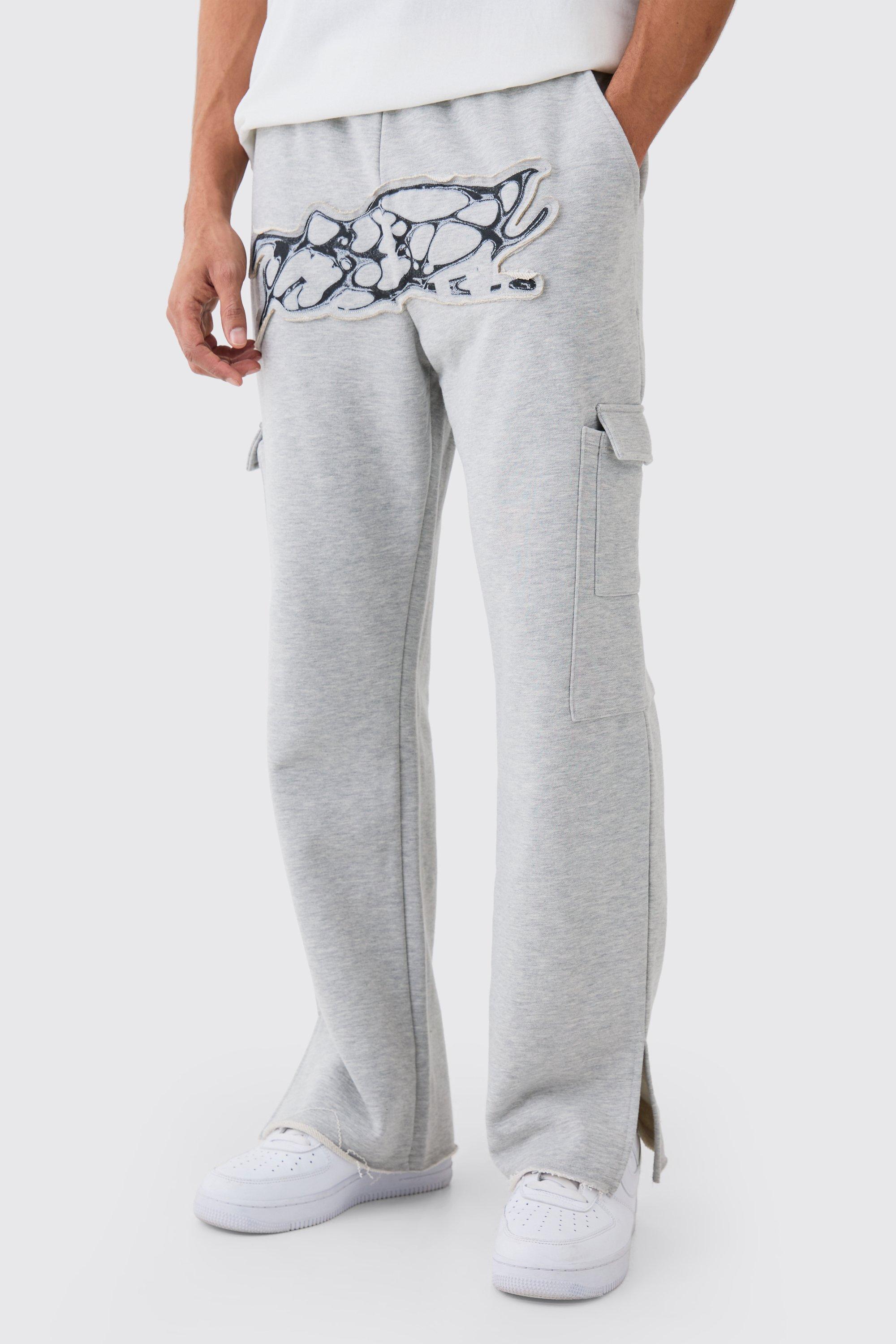 Image of Pantaloni tuta dritti pesanti effetto smagliato con applique e spacco sul fondo, Grigio
