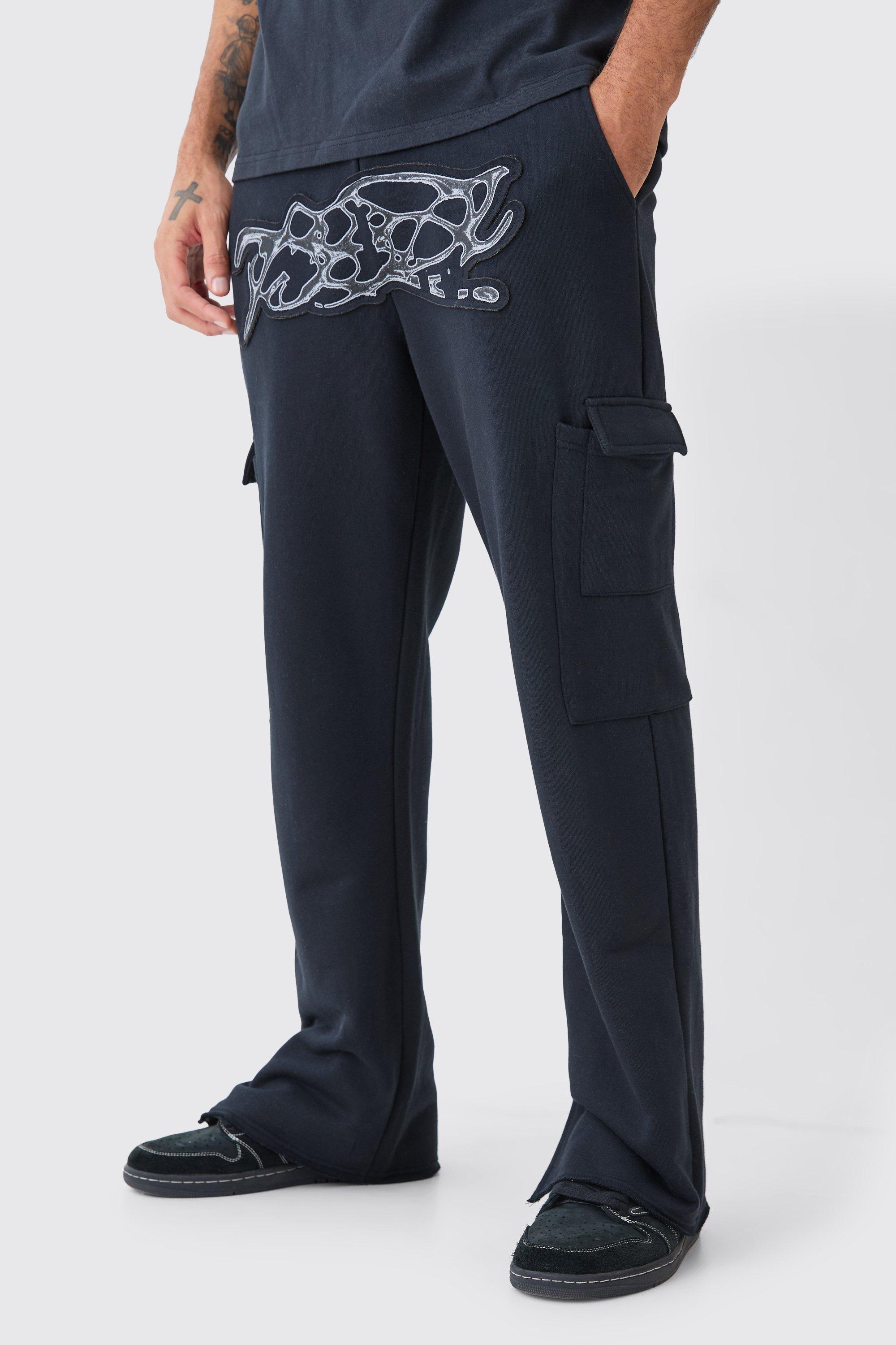 Image of Pantaloni tuta dritti pesanti effetto smagliato con applique e spacco sul fondo, Nero