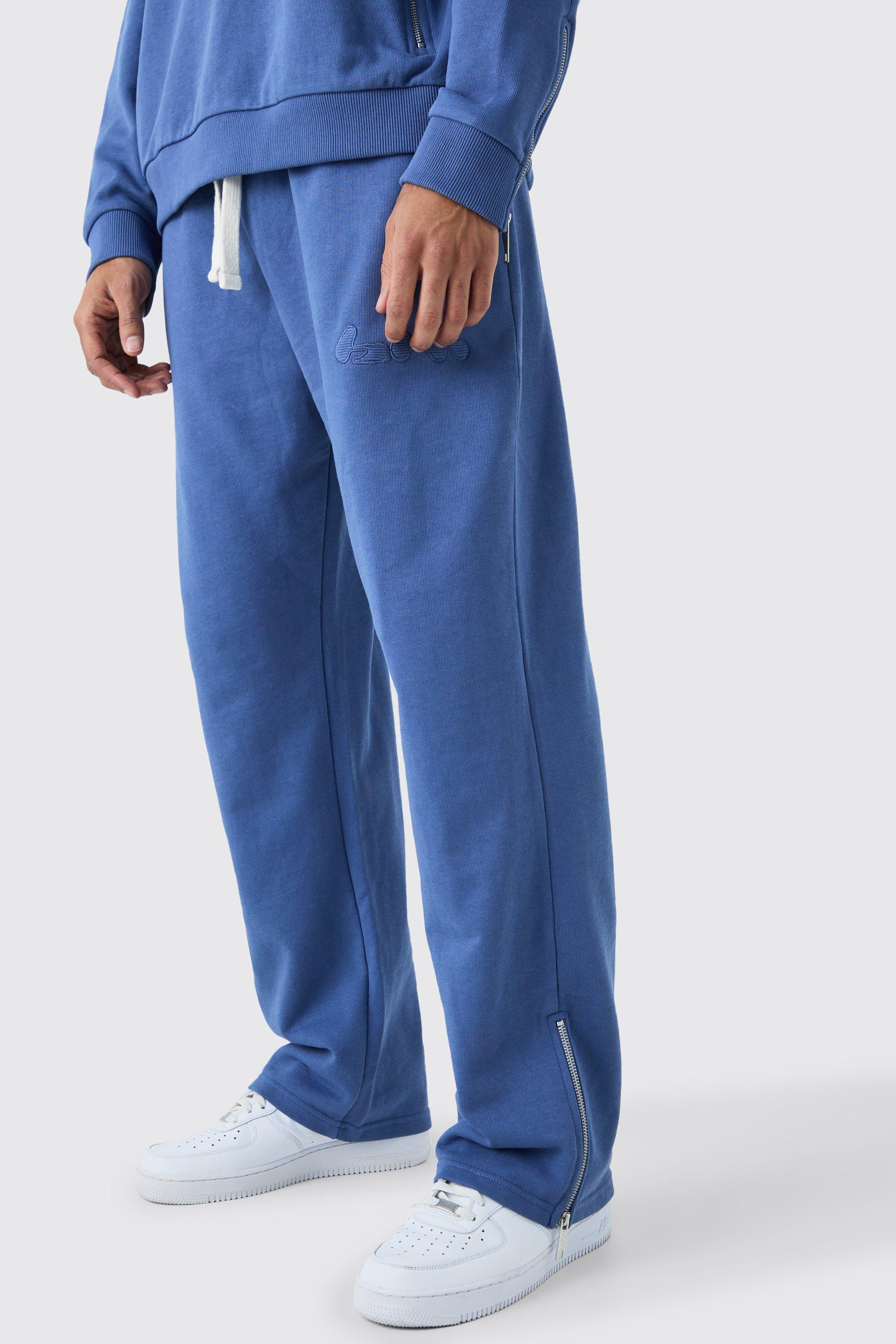 Image of Pantaloni tuta oversize a coste con rovescio a ricci e applique con zip, Azzurro