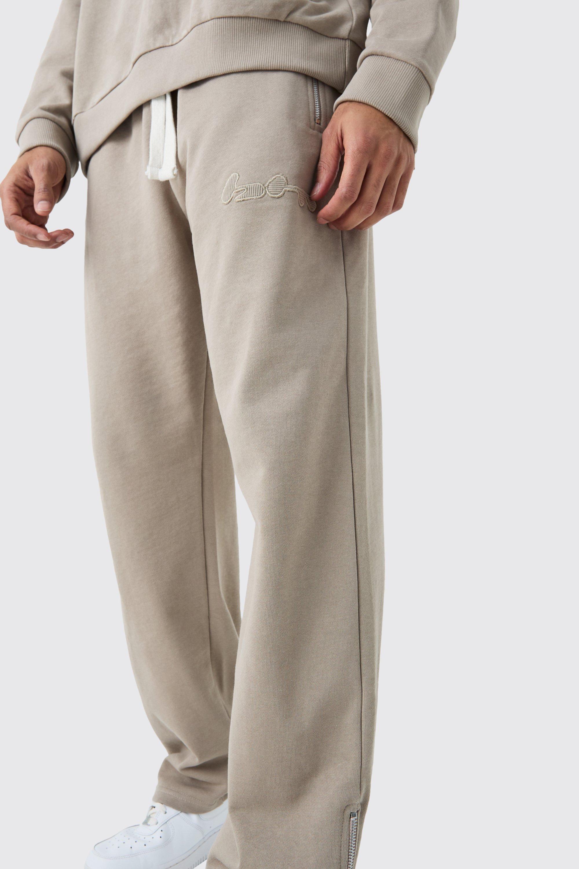 Image of Pantaloni tuta oversize a coste con rovescio a ricci e applique con zip, Grigio