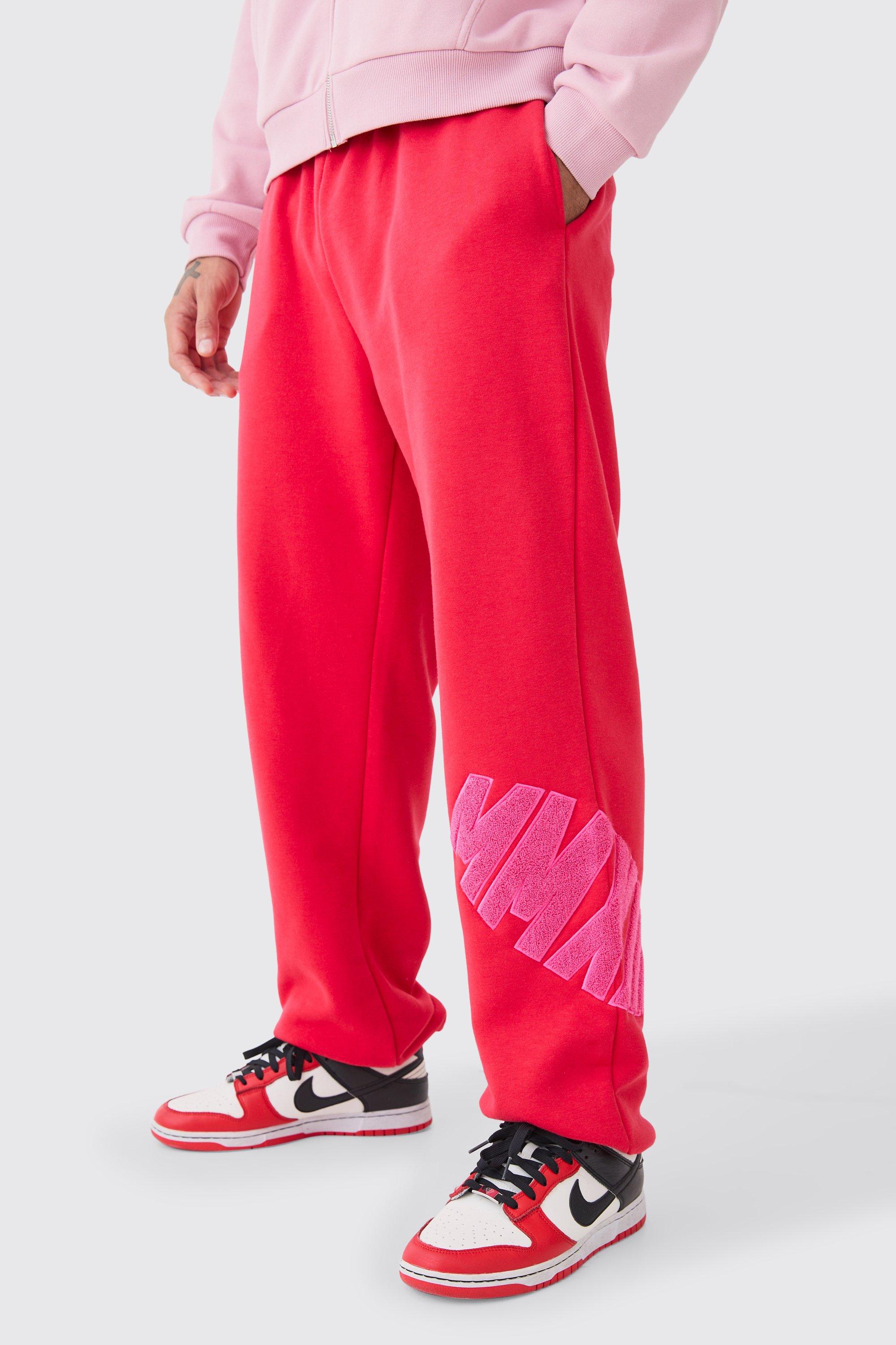 Image of Pantaloni tuta oversize in pile borg con applique, Rosso