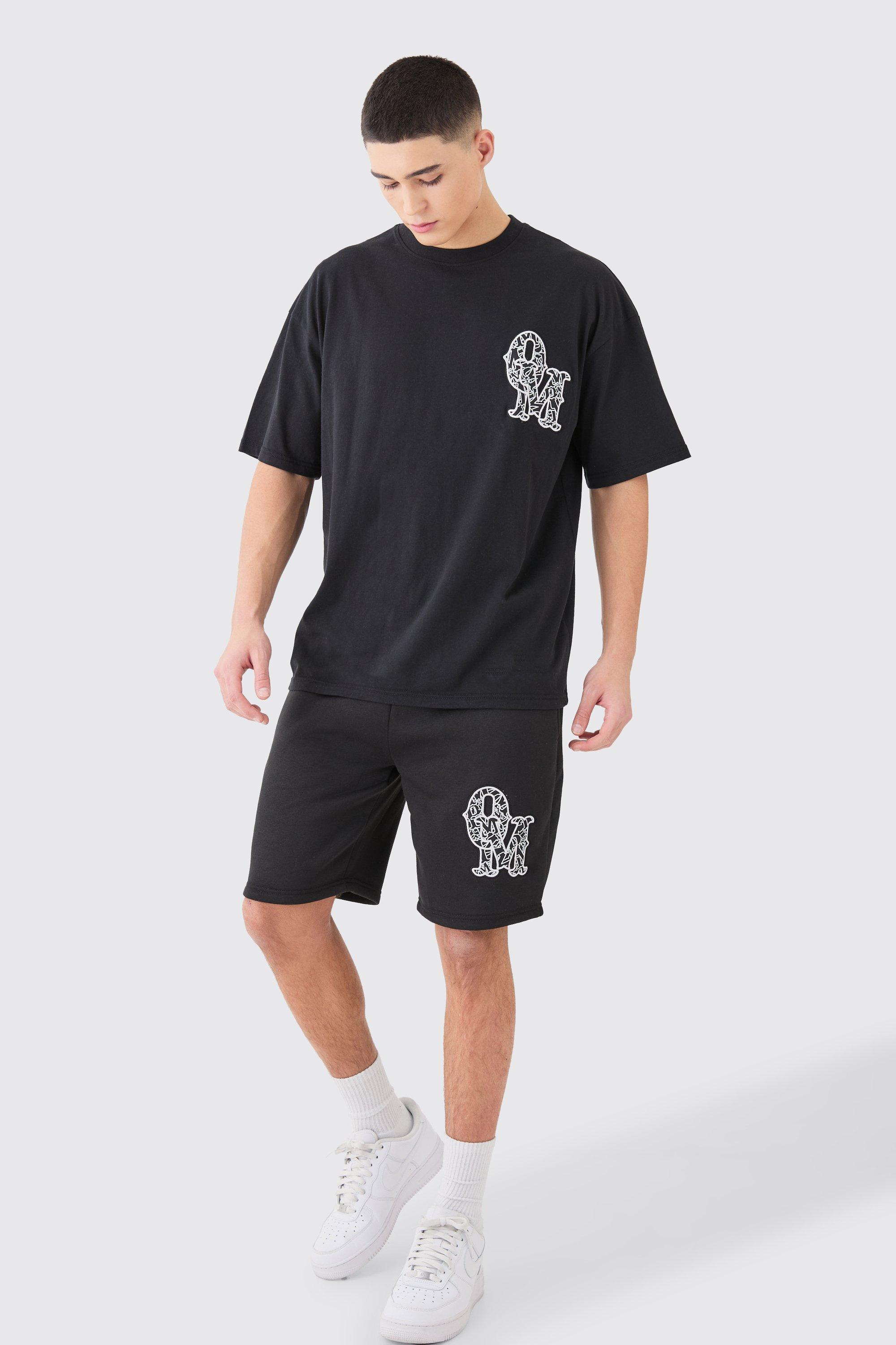 Image of Set T-shirt oversize con applique & pantaloncini, Nero
