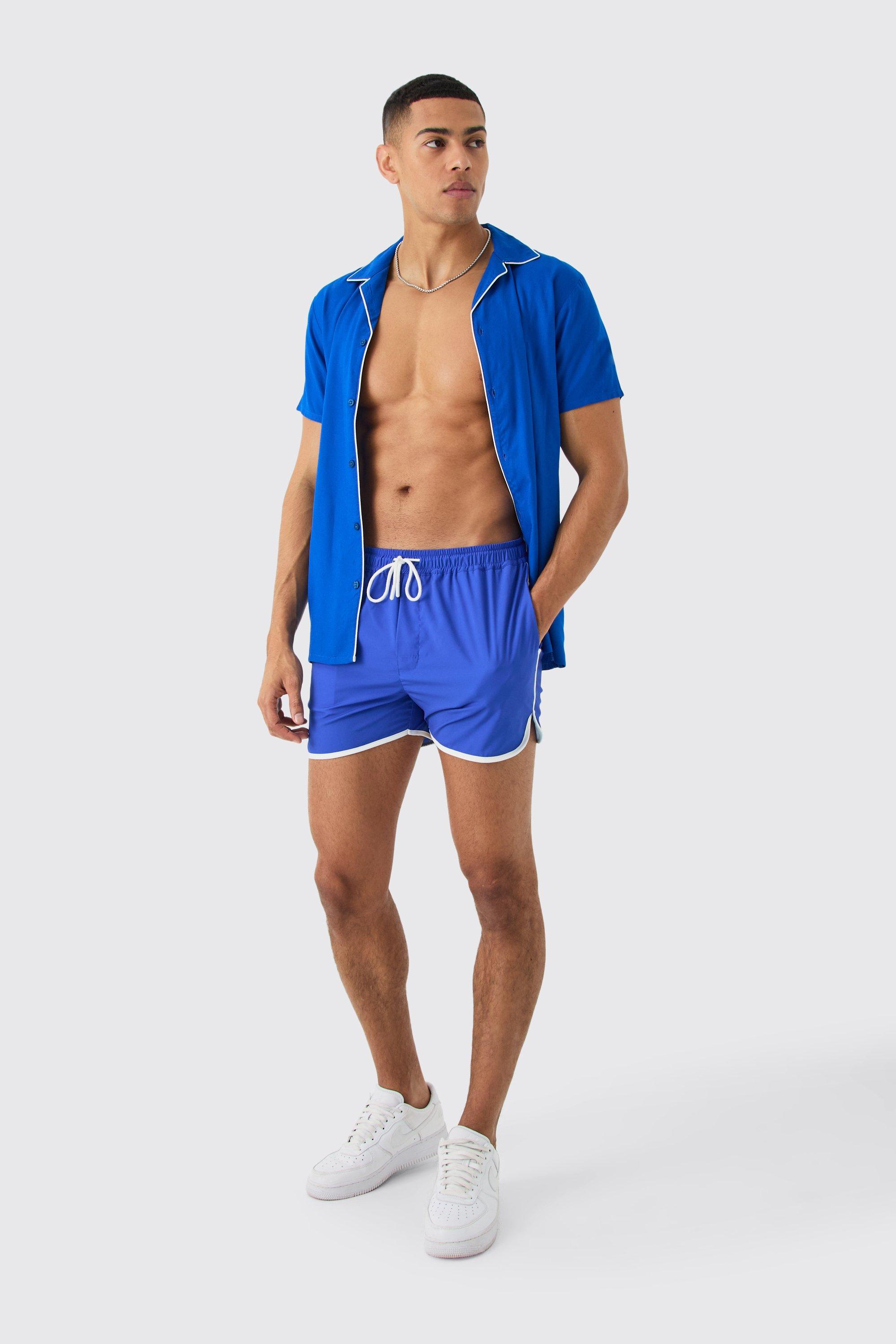 Image of Set camicia a maniche corte in tinta unita con cordoncino & costume a pantaloncino, Azzurro