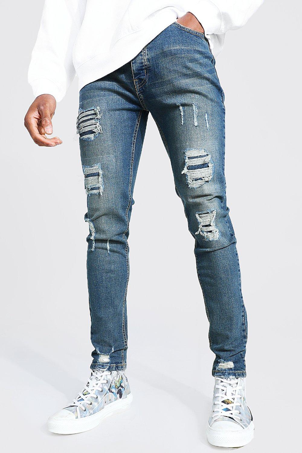 Image of Jeans da uomo Skinny Fit Stretch con strappi & rattoppi, Azzurro
