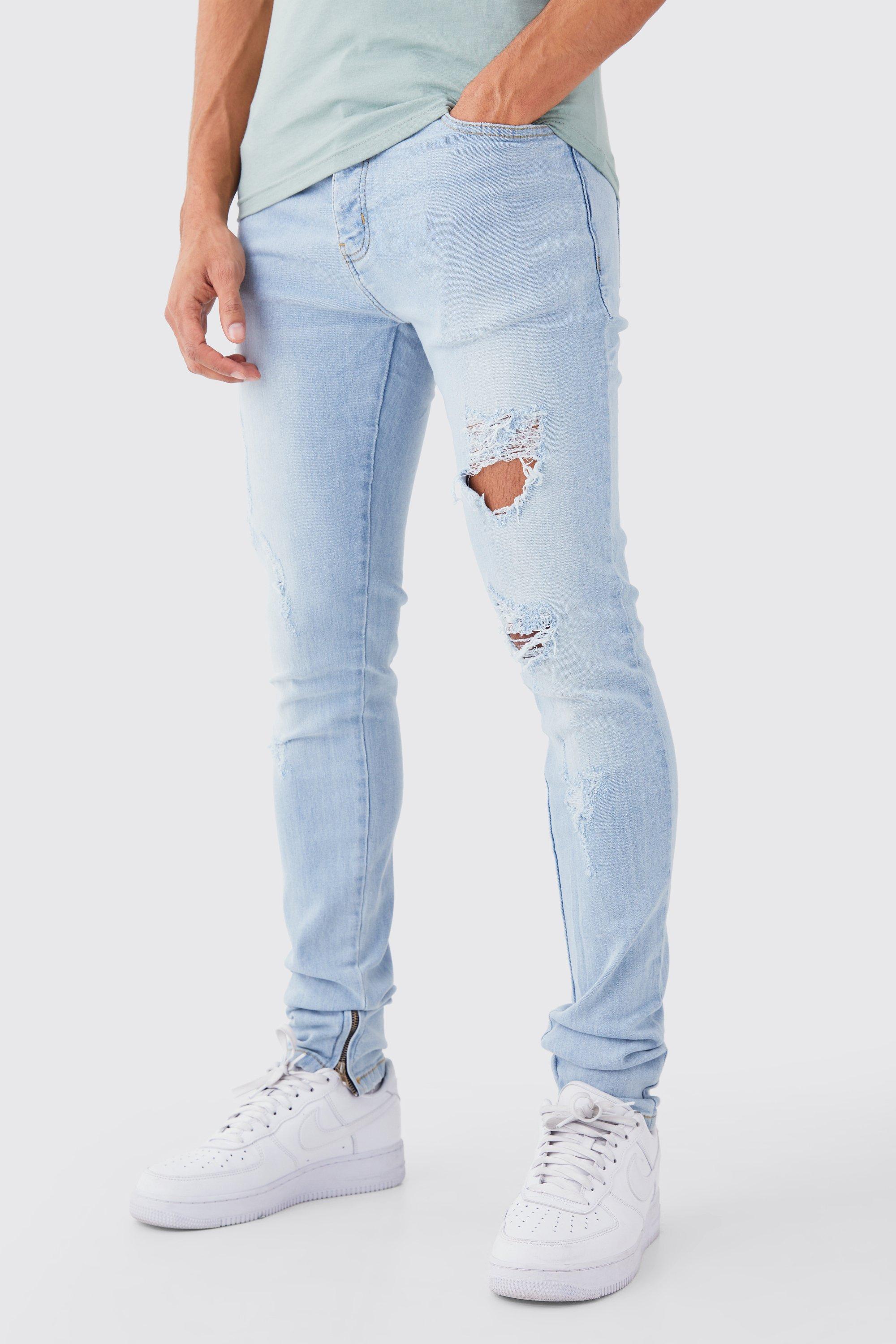 Image of Jeans da uomo Skinny Fit Stretch con tagli all over e pieghe sul fondo, Azzurro
