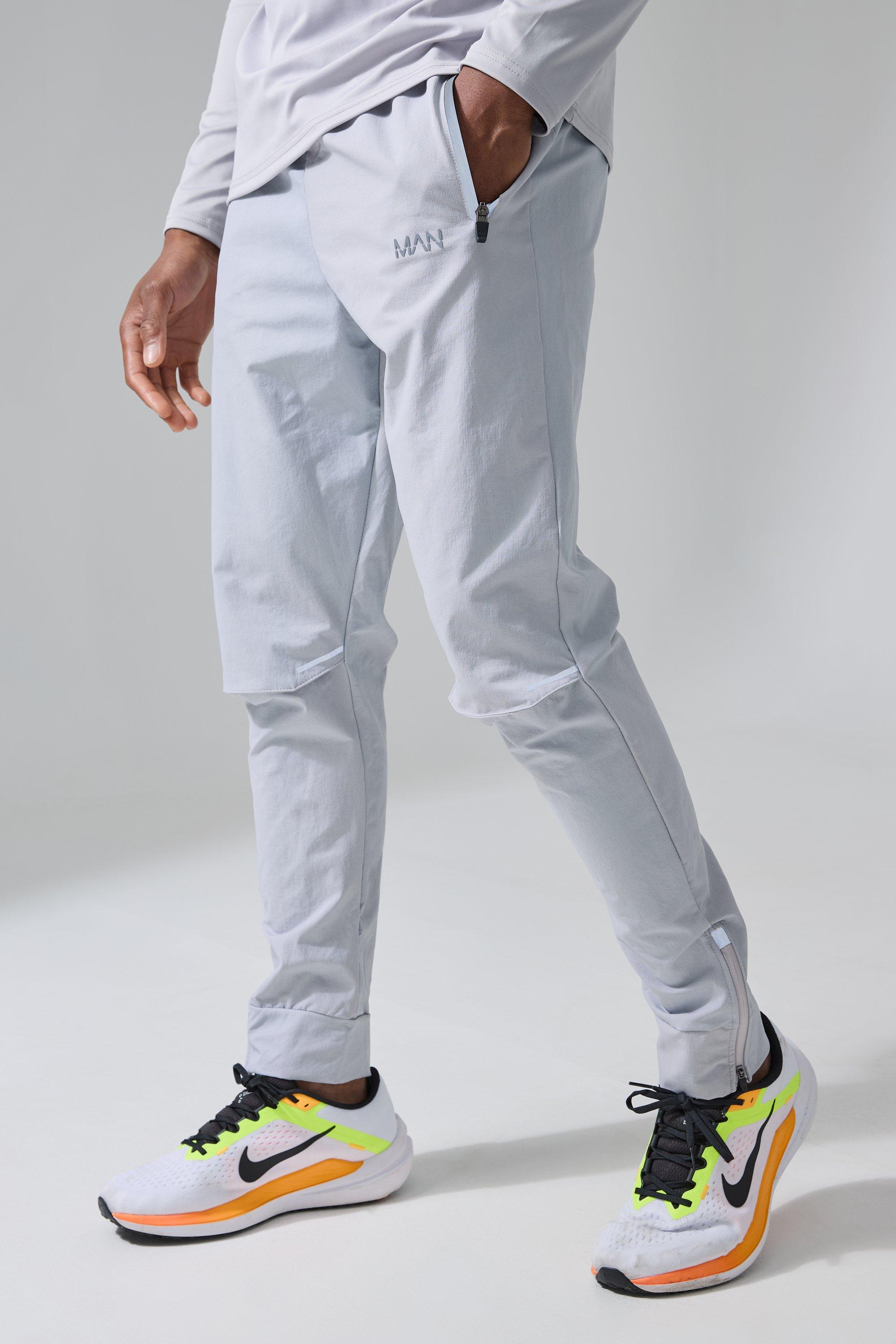 Image of Pantaloni tuta da corsa Man Active con spacco sul ginocchio, Grigio