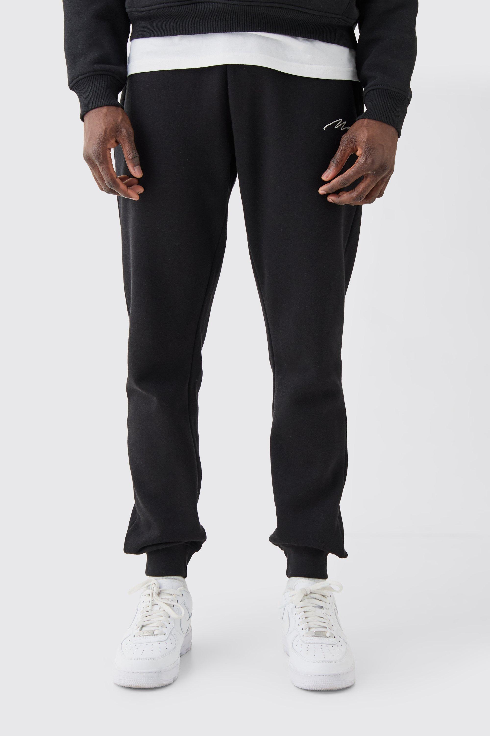 Image of Pantaloni tuta Skinny Fit con firma Man, Nero