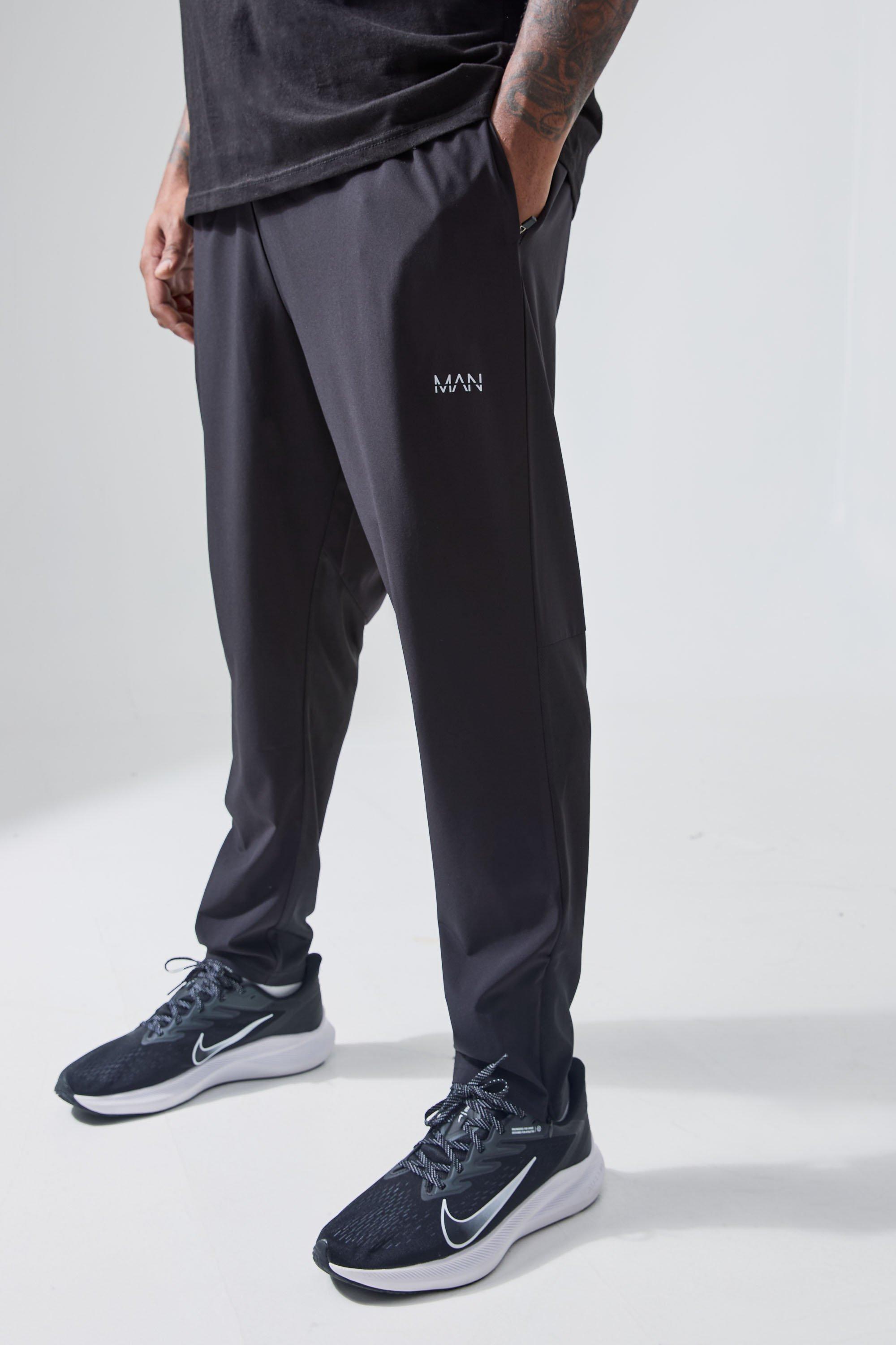 Image of Pantaloni tuta Plus Size Man Active Gym per alta performance con tasche e zip, Nero