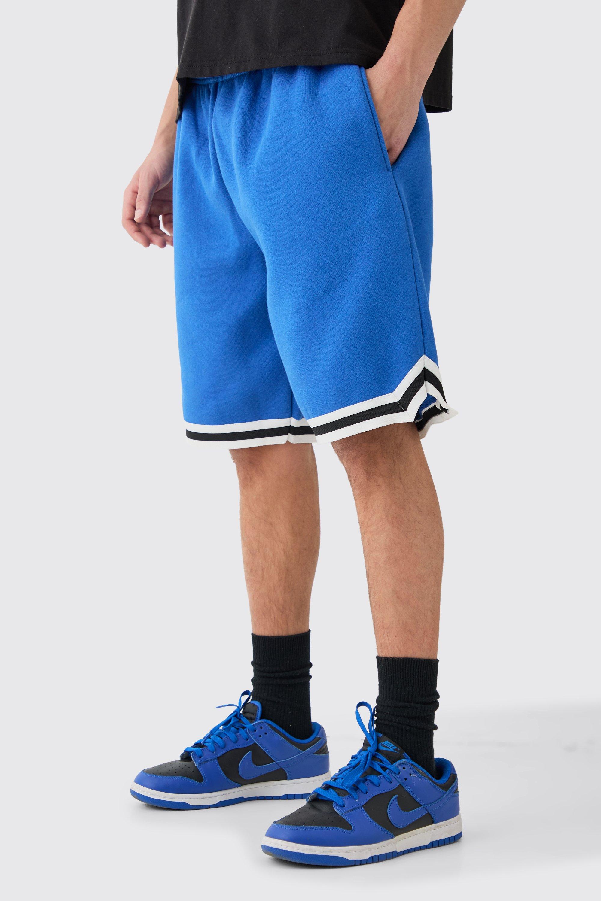 Image of Pantaloncini da basket oversize di media lunghezza con striscia in jersey, Azzurro