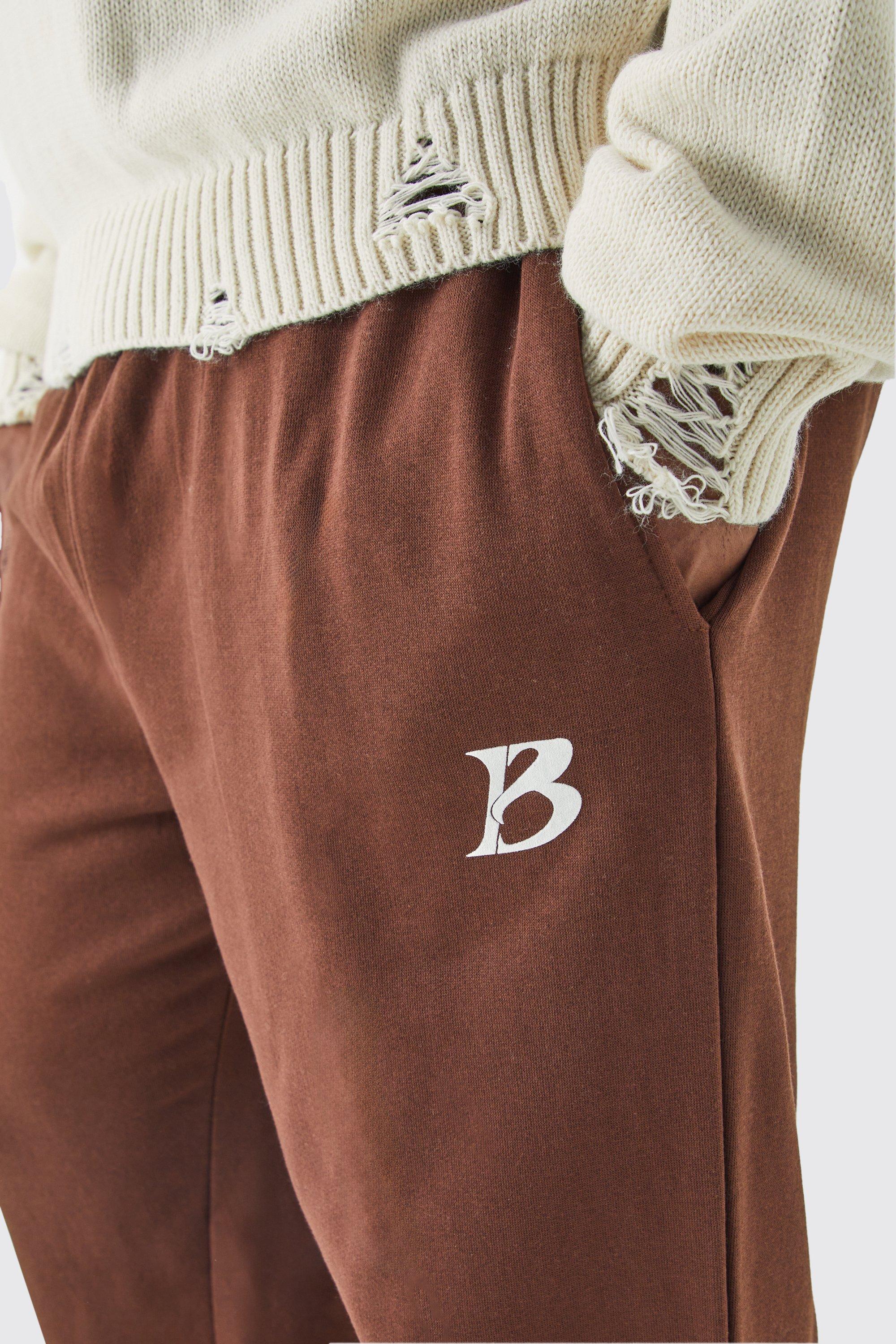 Image of Pantaloni tuta Plus Size color cioccolato con slogan Core B, Brown