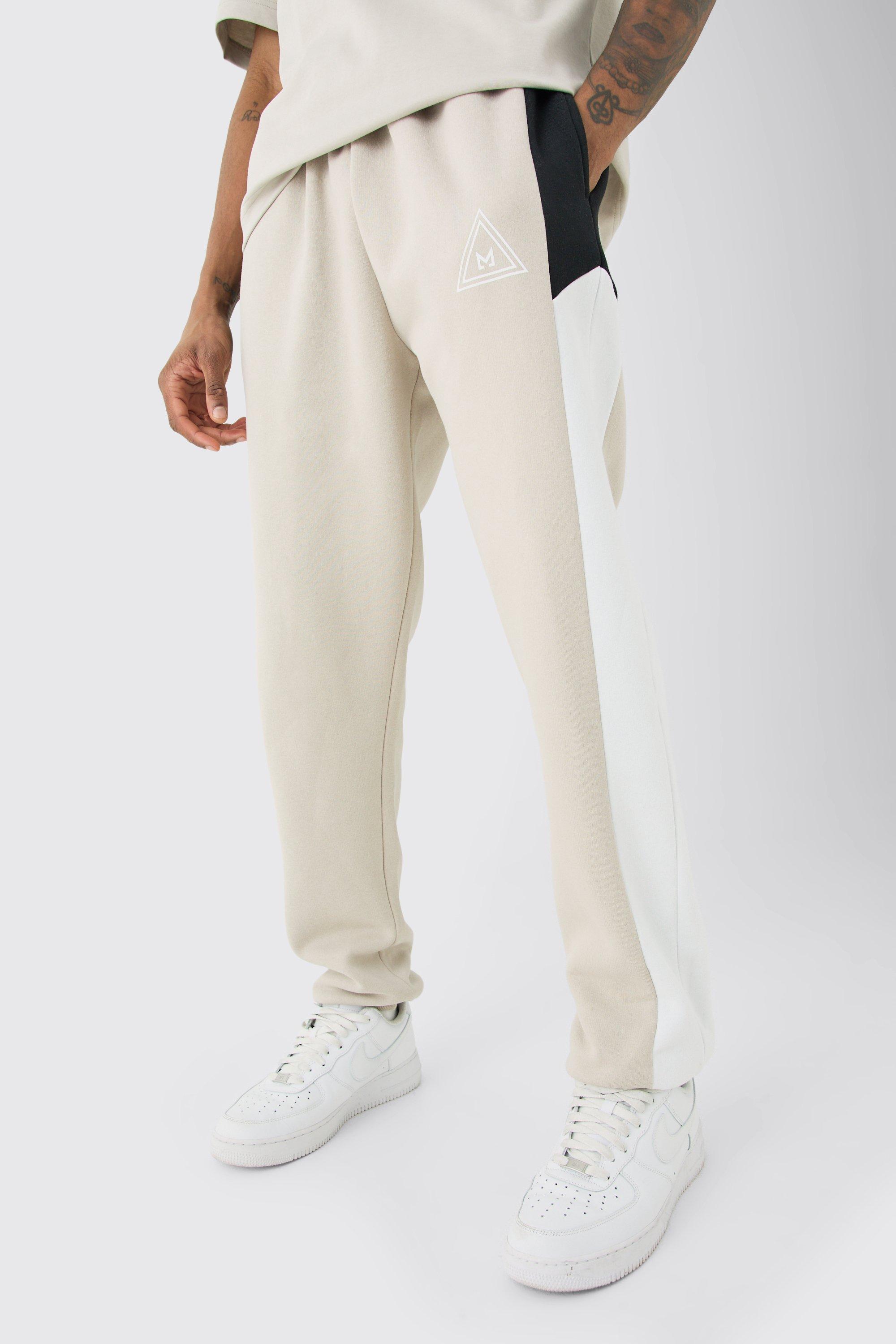 Image of Pantaloni tuta Tall a blocchi di colore color pietra con logo, Beige