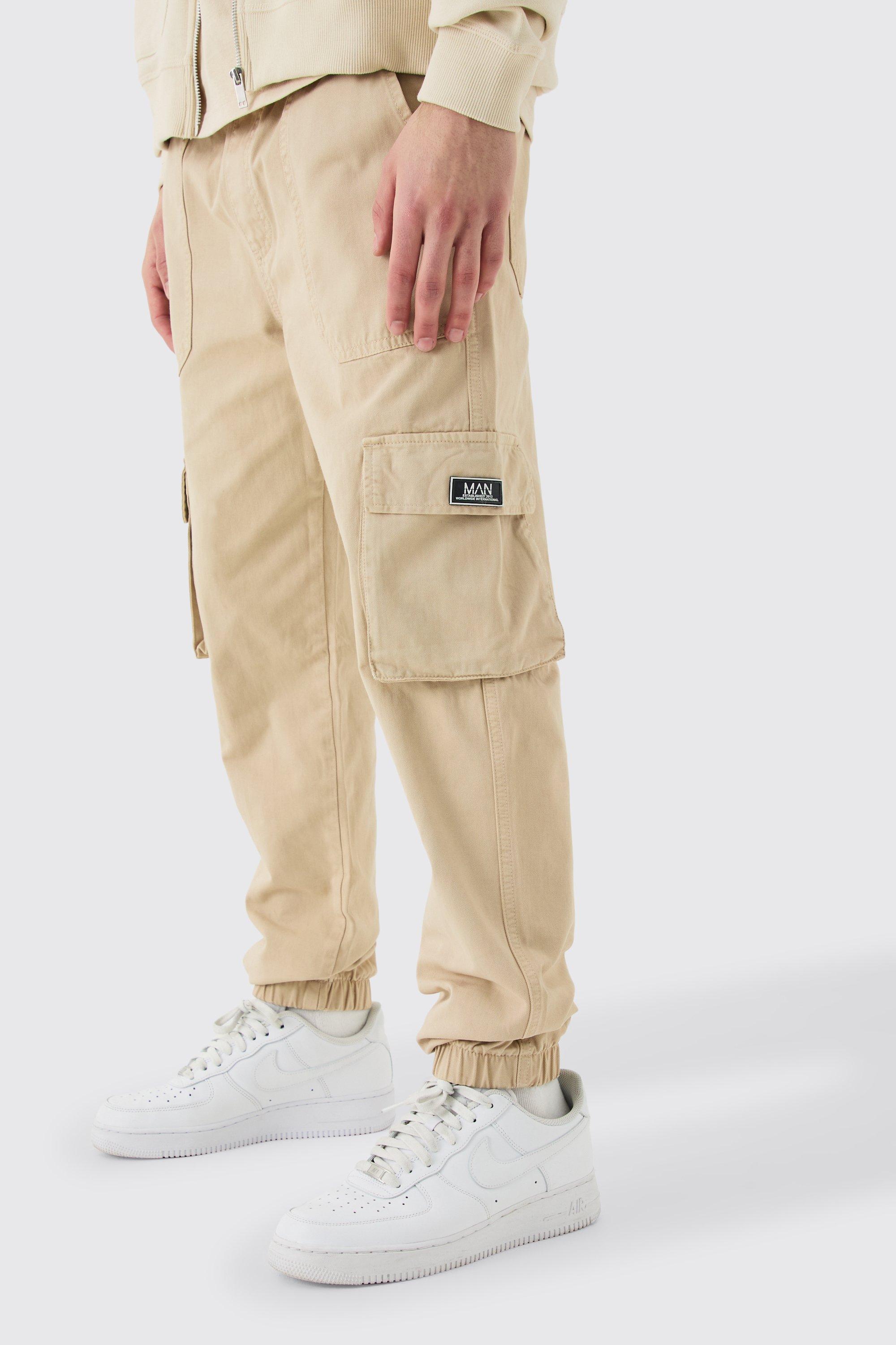 Image of Pantaloni tuta Cargo Slim Fit con elastico in vita e stemmi, Beige