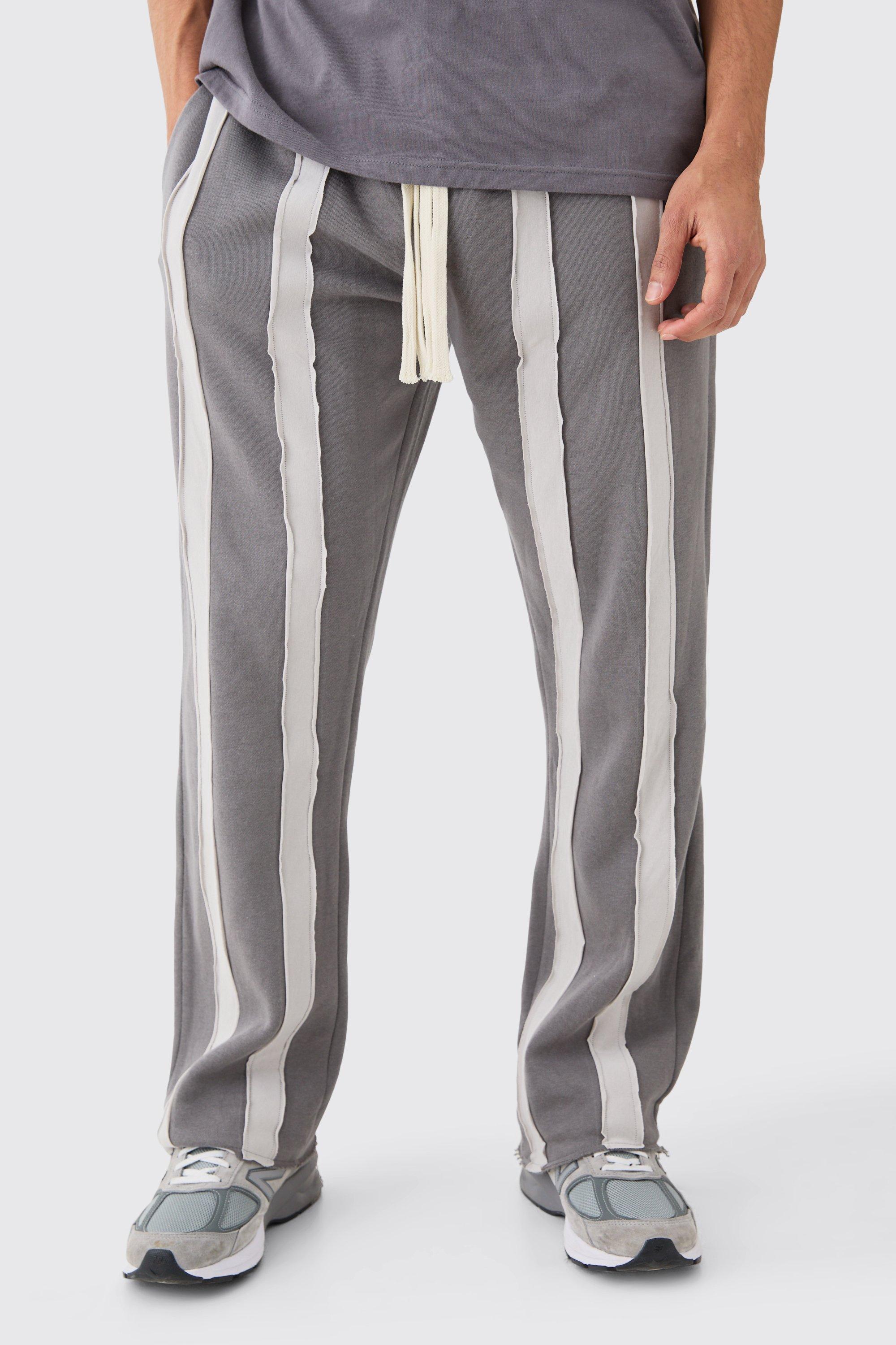 Image of Pantaloni tuta rilassati a righe Cut & Sew con fondo grezzo, Grigio