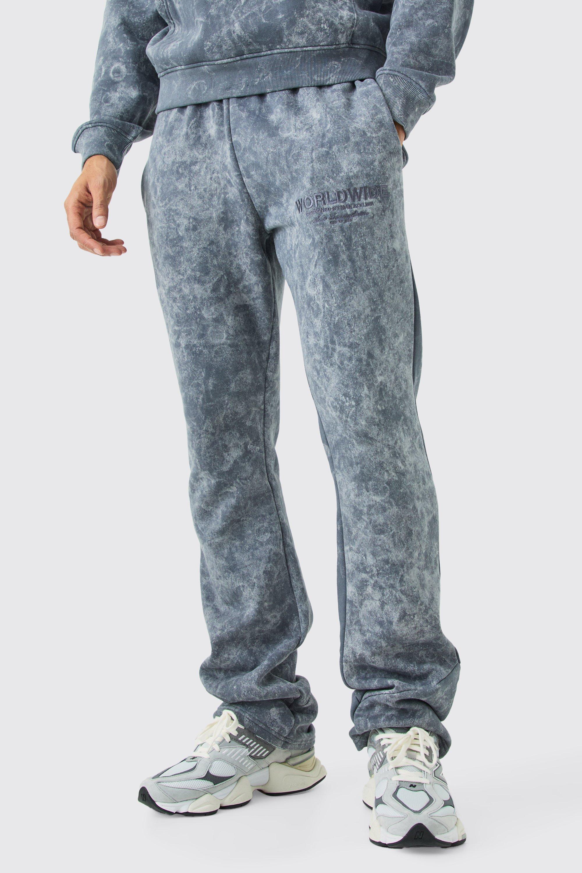 Image of Pantaloni tuta slavati con applique, smagliature e pieghe sul fondo, Grigio