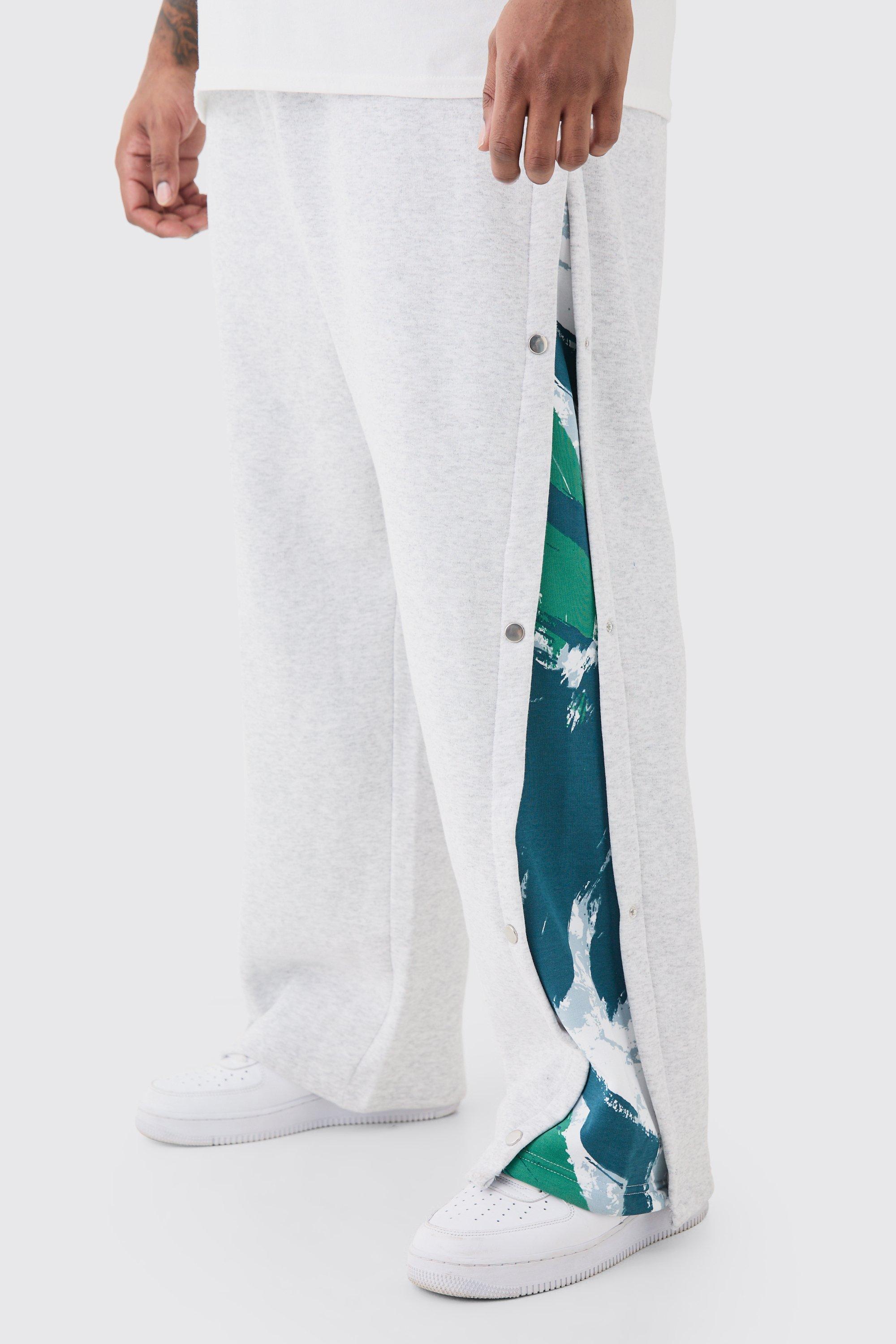 Image of Pantaloni tuta Plus Size rilassati con stampa e pannelli laterali con bottoni a pressione, Grigio