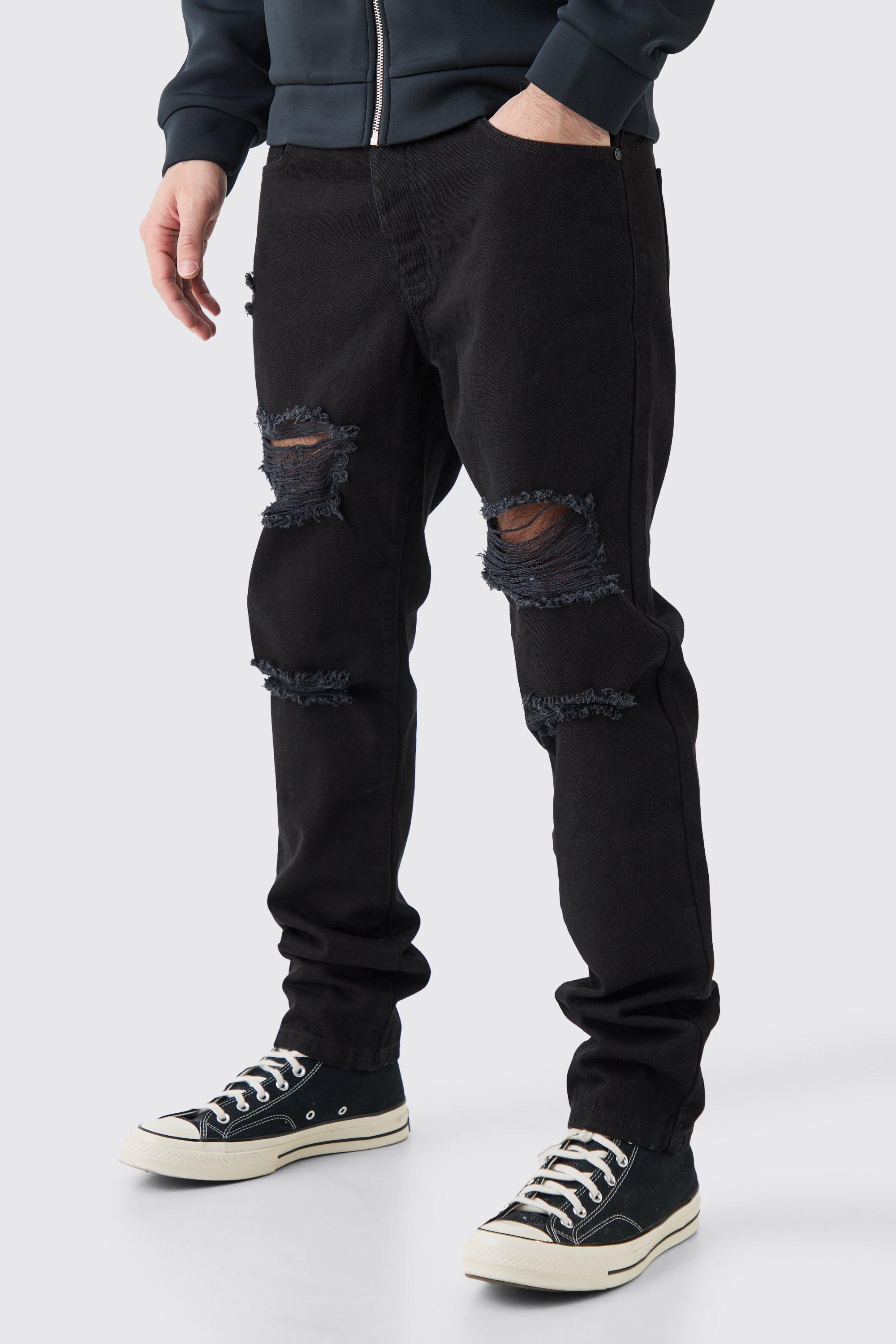 Image of Jeans Slim Fit in True Black in denim rigido con strappi all over, Nero