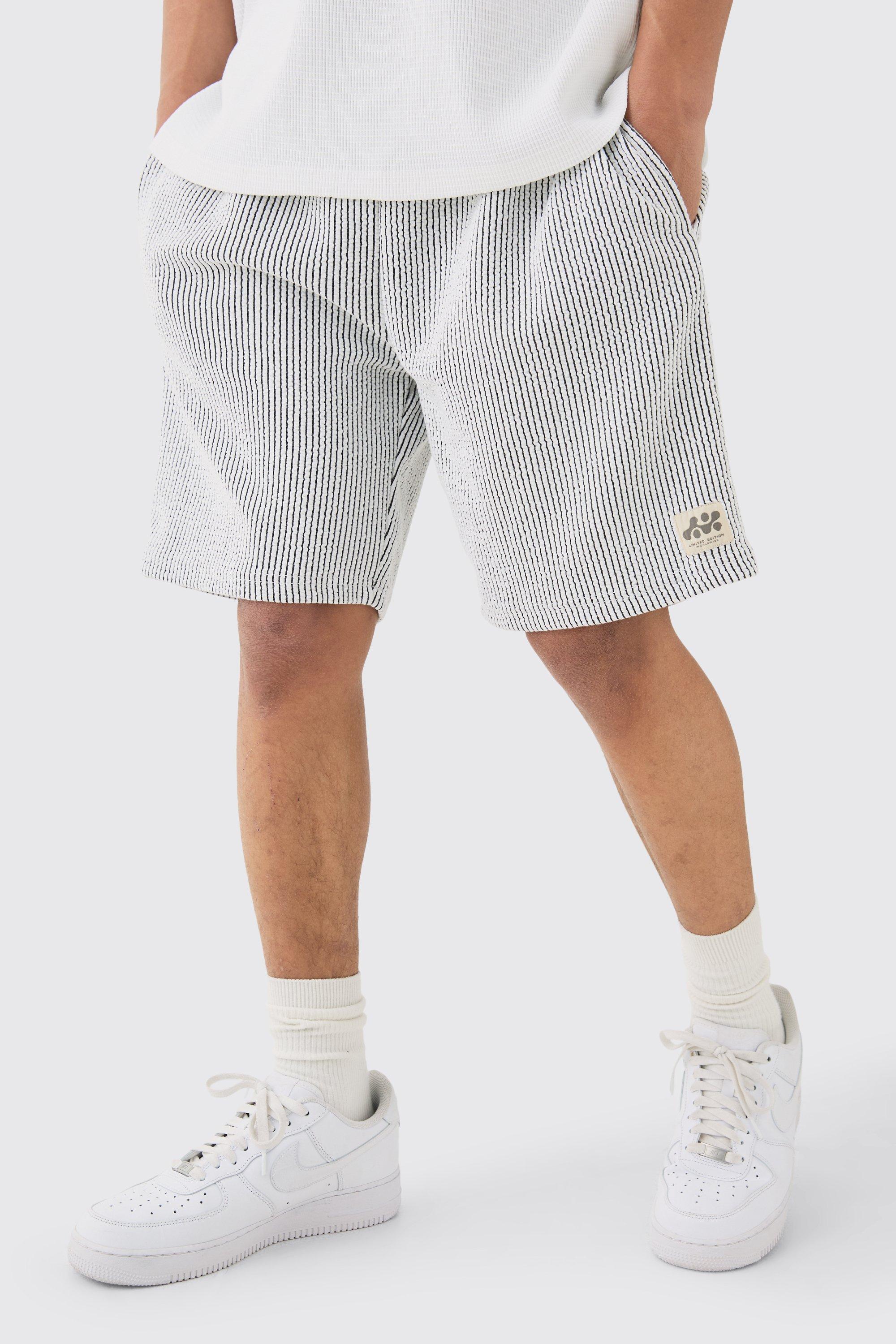 Image of Relaxed Mid Length Textured Short With Woven Tab, Bianco