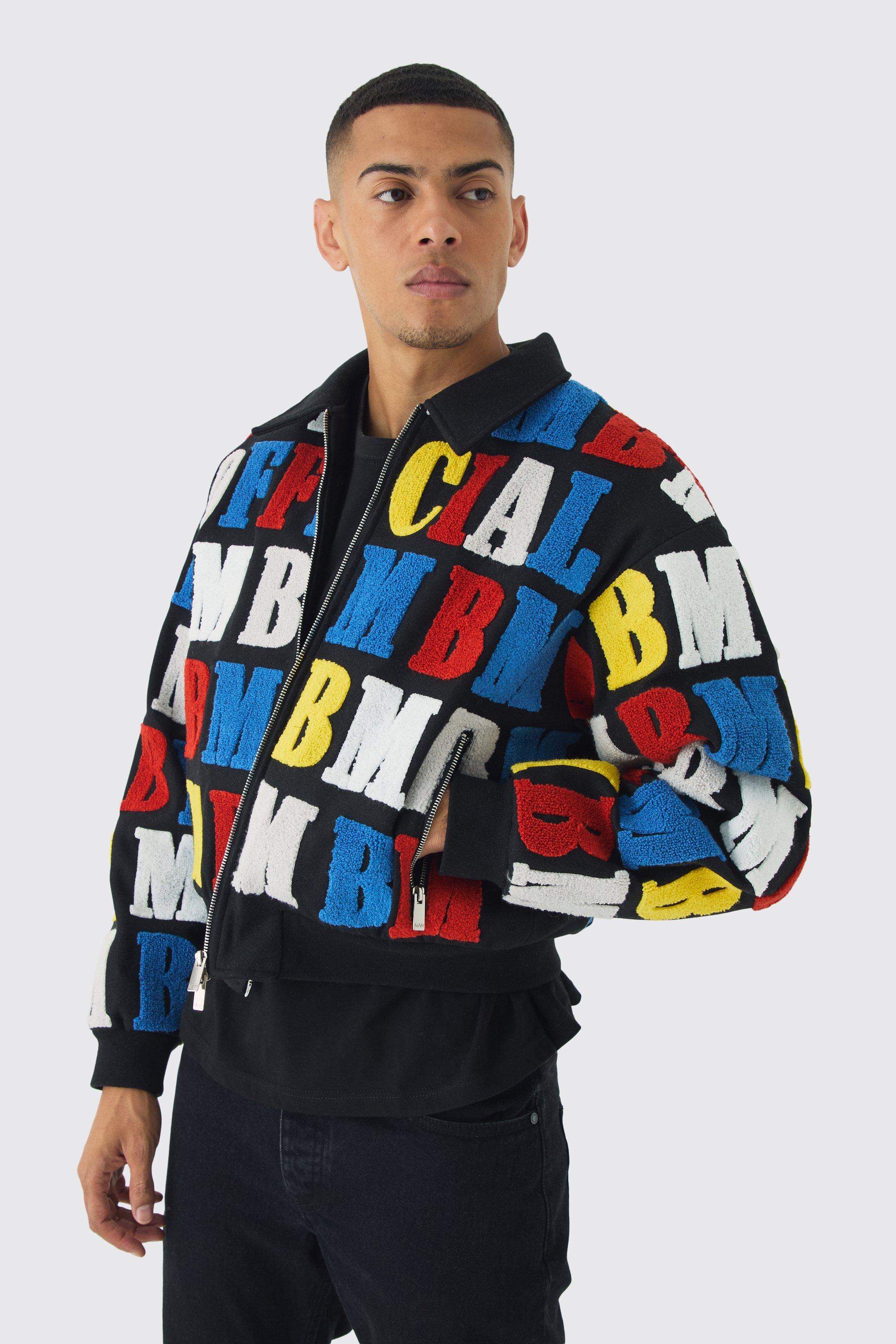 Image of Giacca squadrata di colore nero stile college con stemma e colletto, Nero