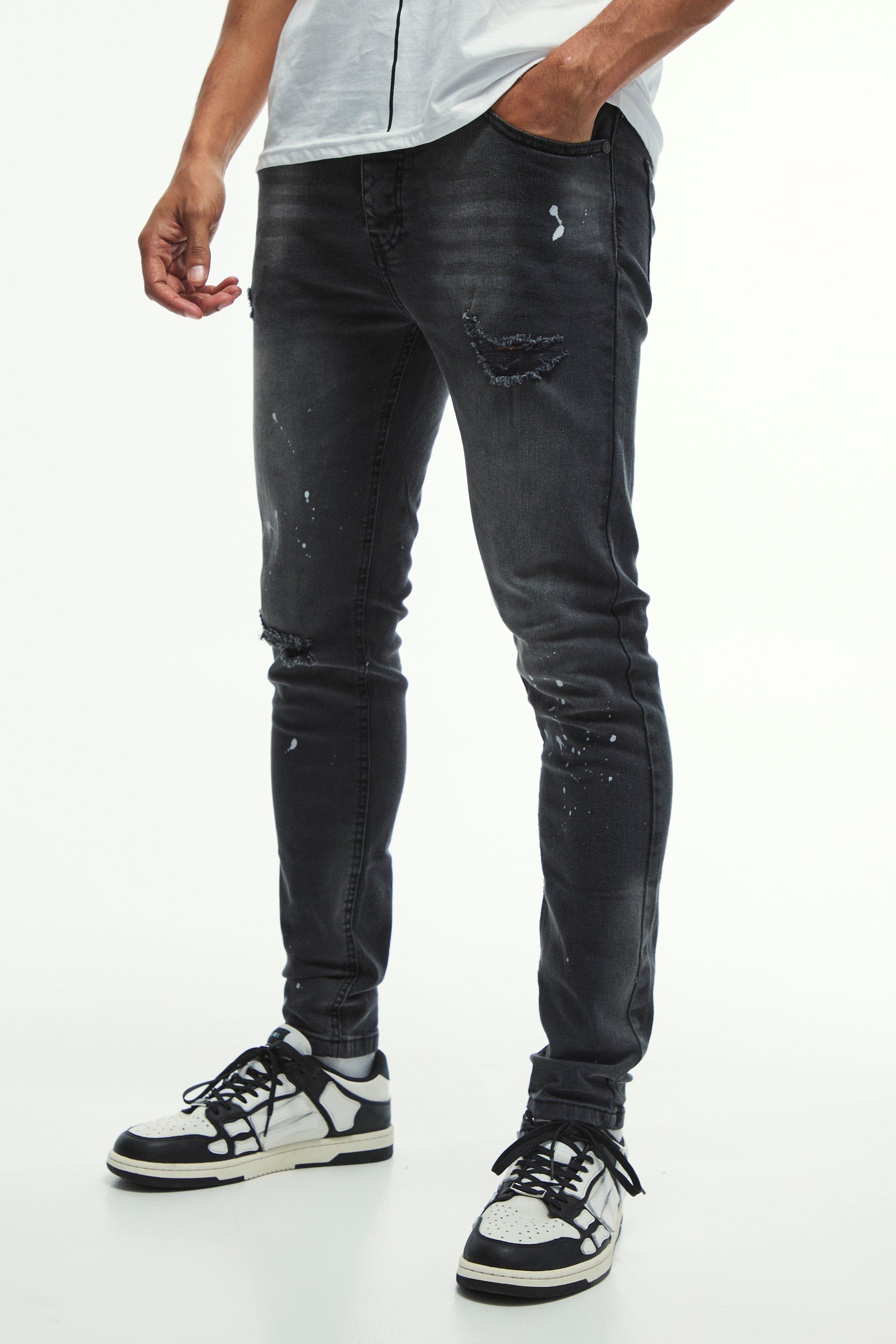 Jeans Skinny Fit in Stretch con strappi sul ginocchio e schizzi di colore, Nero