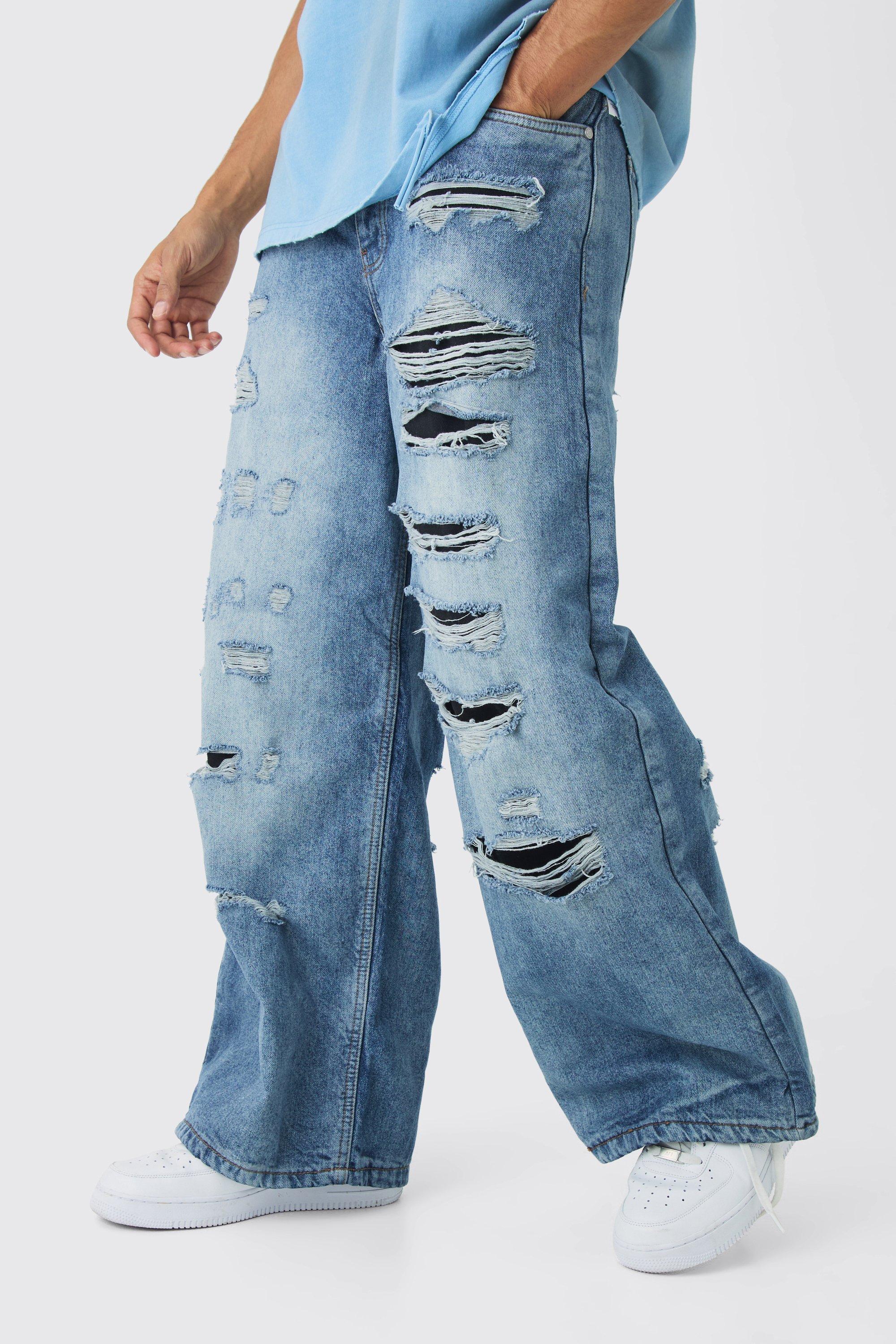 Jeans super comodi in denim rigido con strappi & rattoppi, Azzurro