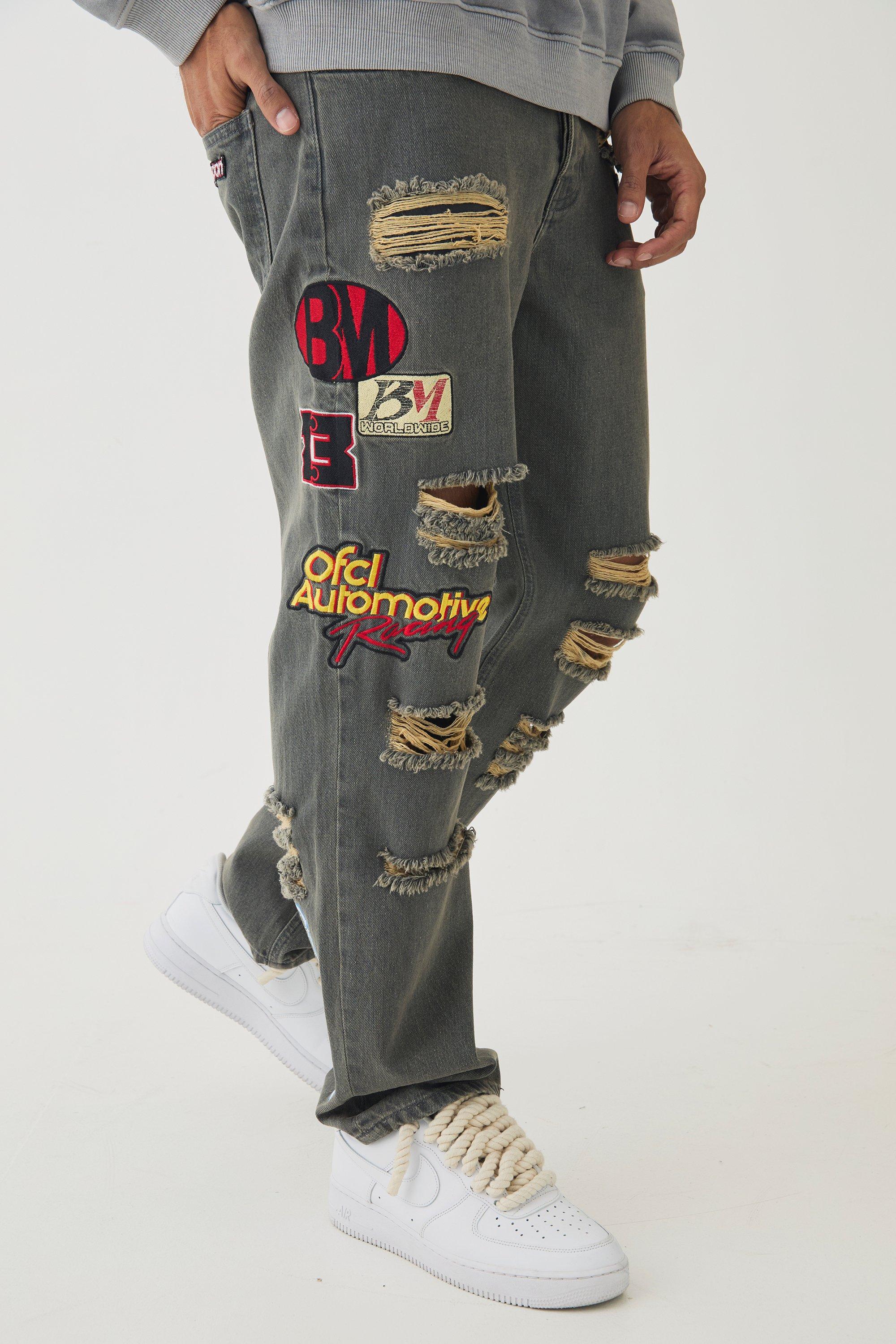 Jeans rilassati in denim rigido con applique di stemma e strappi, Grigio