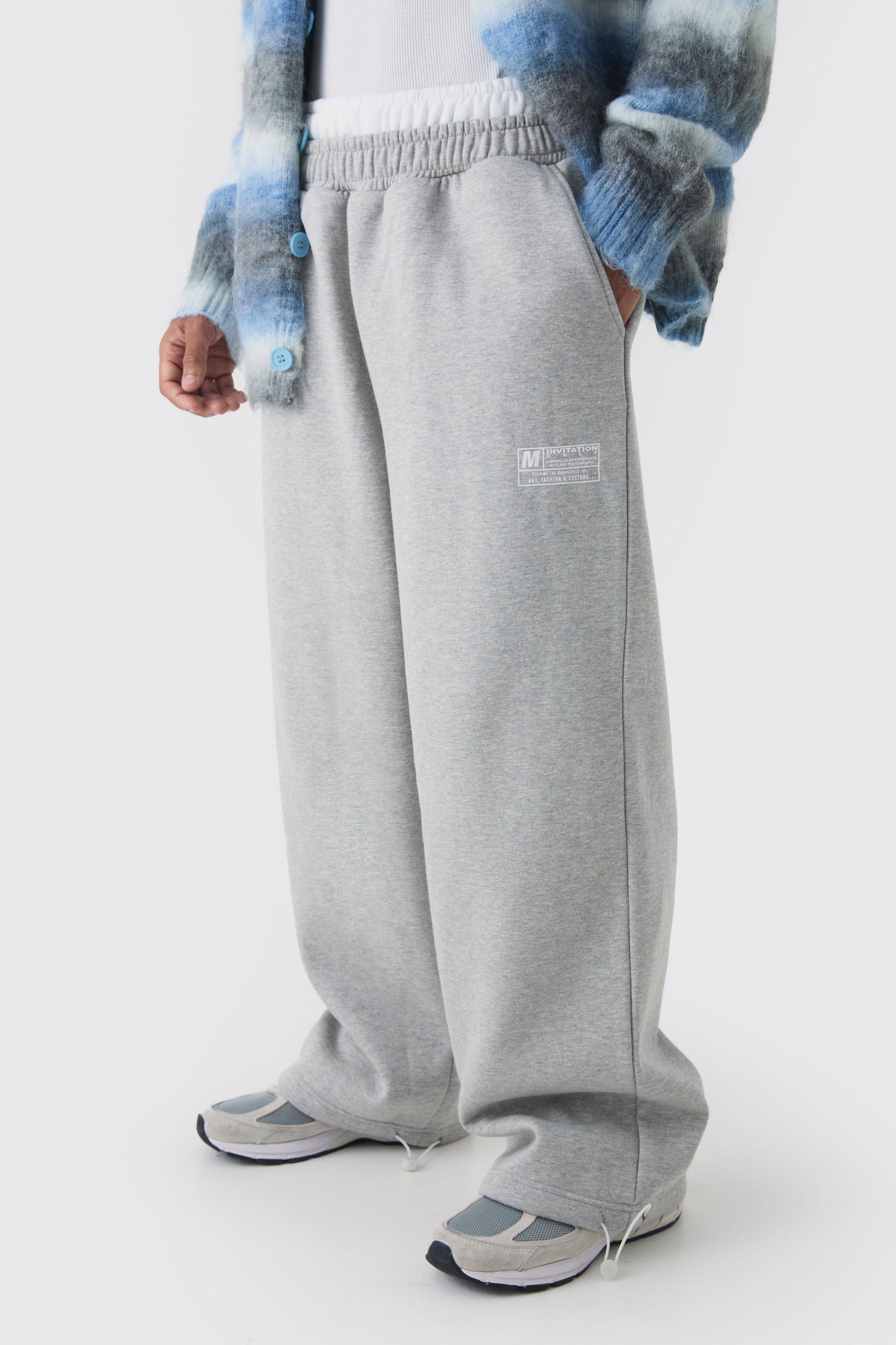 Image of Pantaloni tuta a gamba ampia con doppia fascia in vita e laccetti sui polsini, Grigio