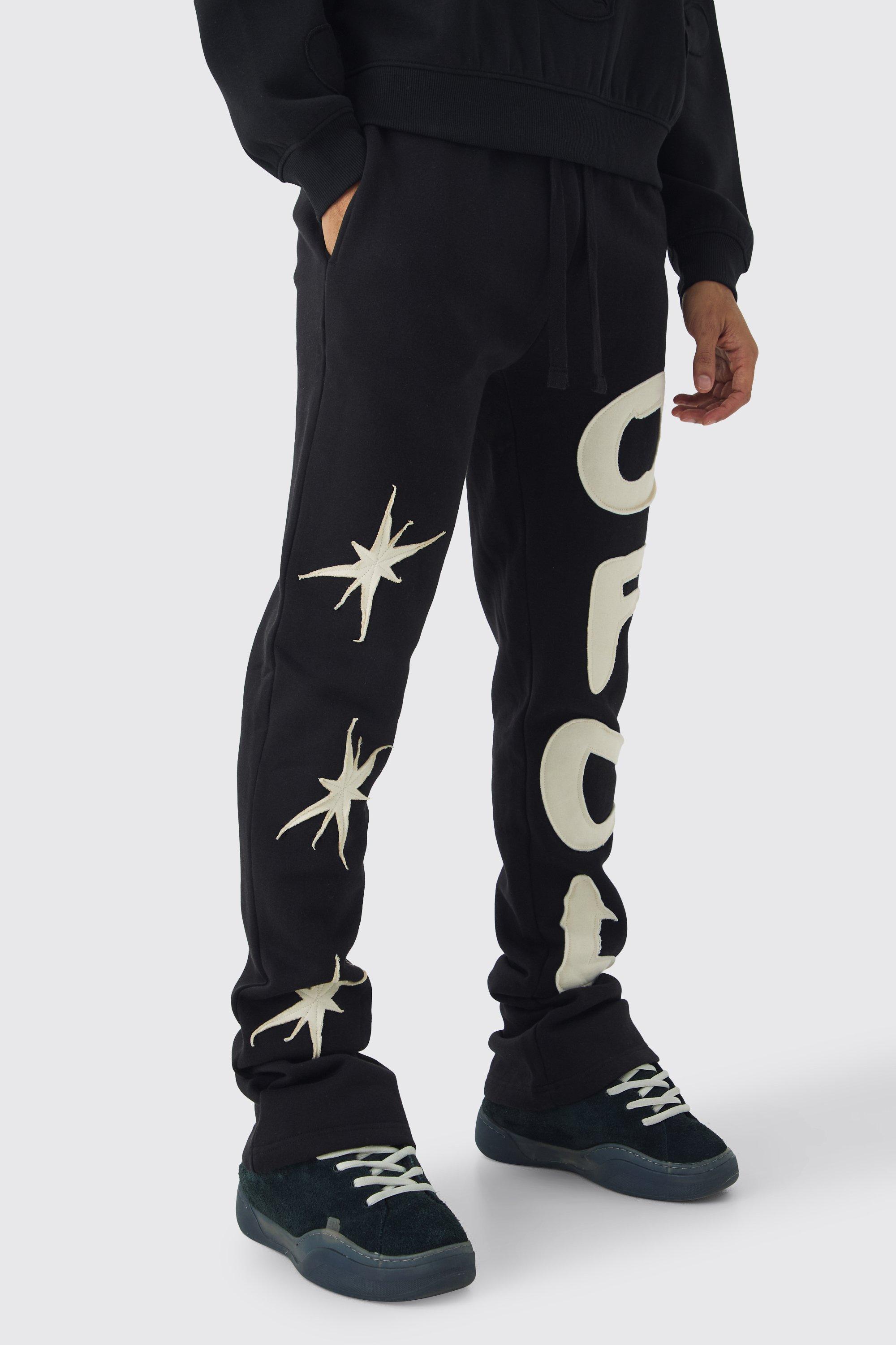Pantaloni tuta Slim Fit con applique a stella e pieghe sul fondo, Nero