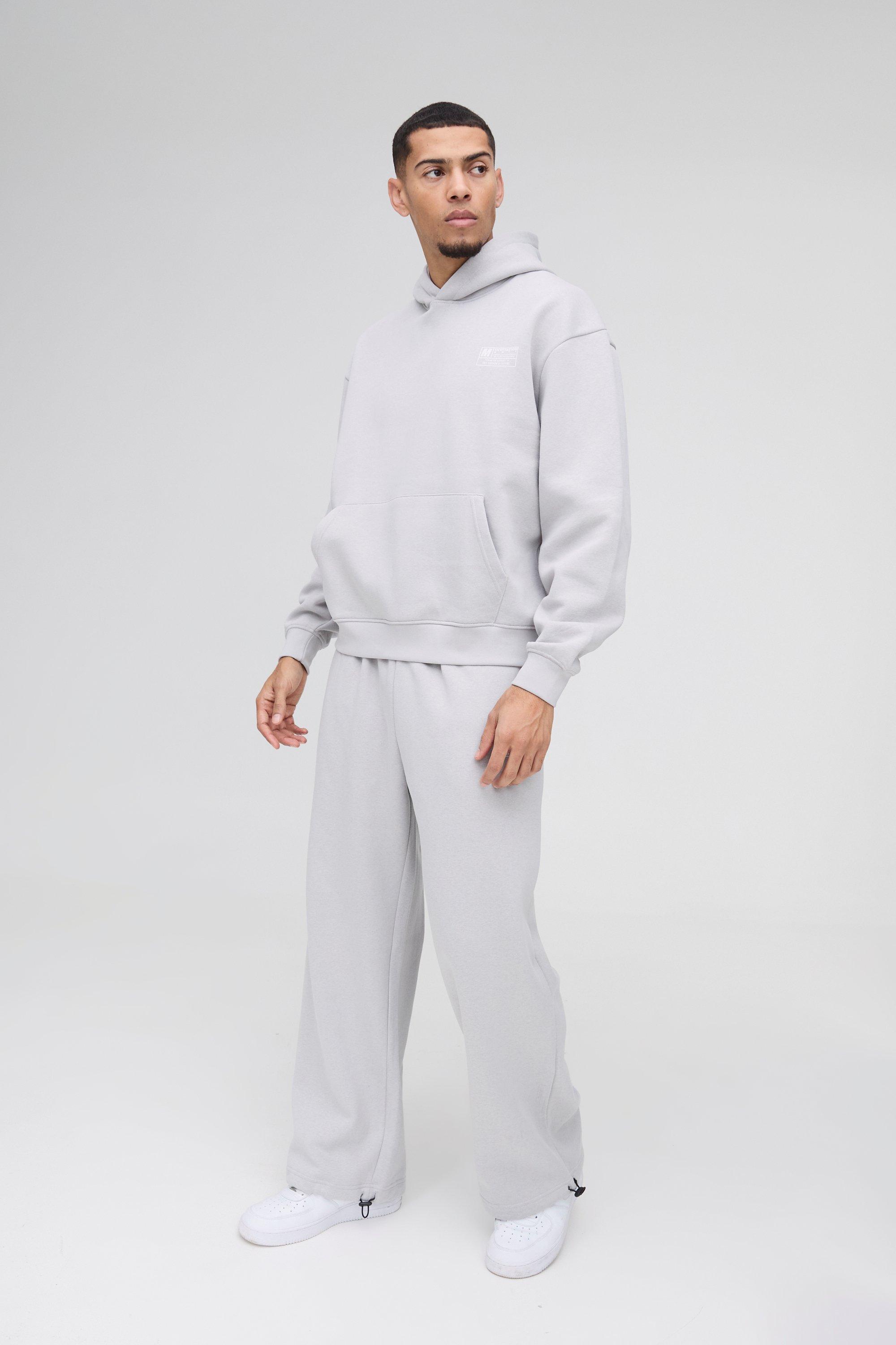 Tuta sportiva squadrata oversize con cappuccio & pantaloni a gamba ampia con laccetti sui polsini, Grigio