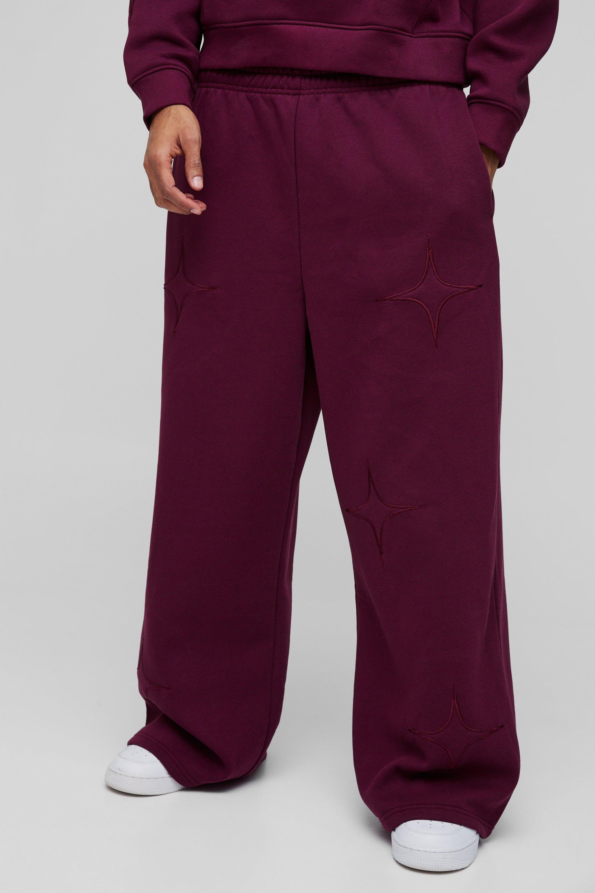 Pantaloni tuta a gamba ampia con applique a stella e spacco sul fondo, Rosso