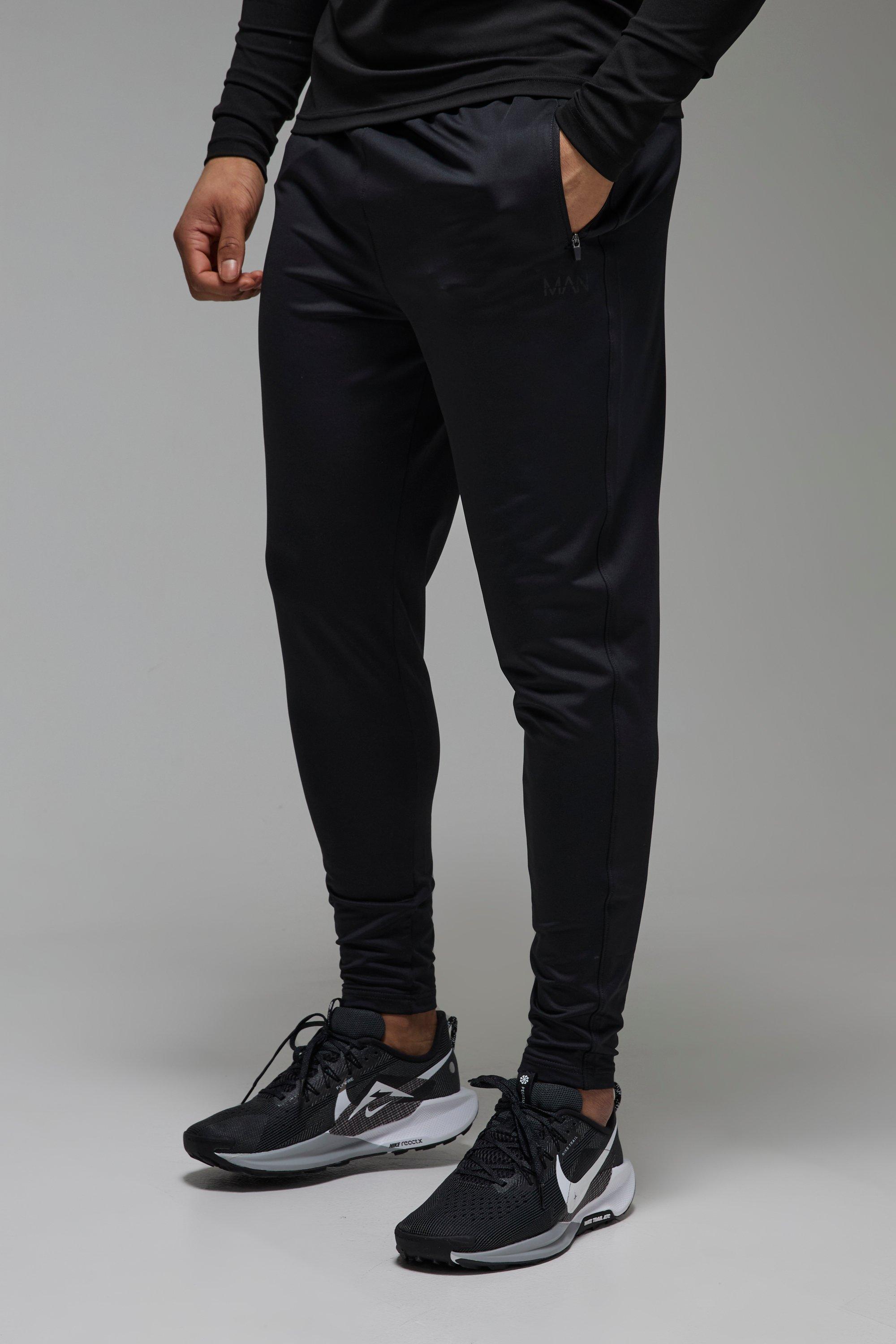 Image of Pantaloni tuta affusolati Man Active per alta performance in Stretch, Nero