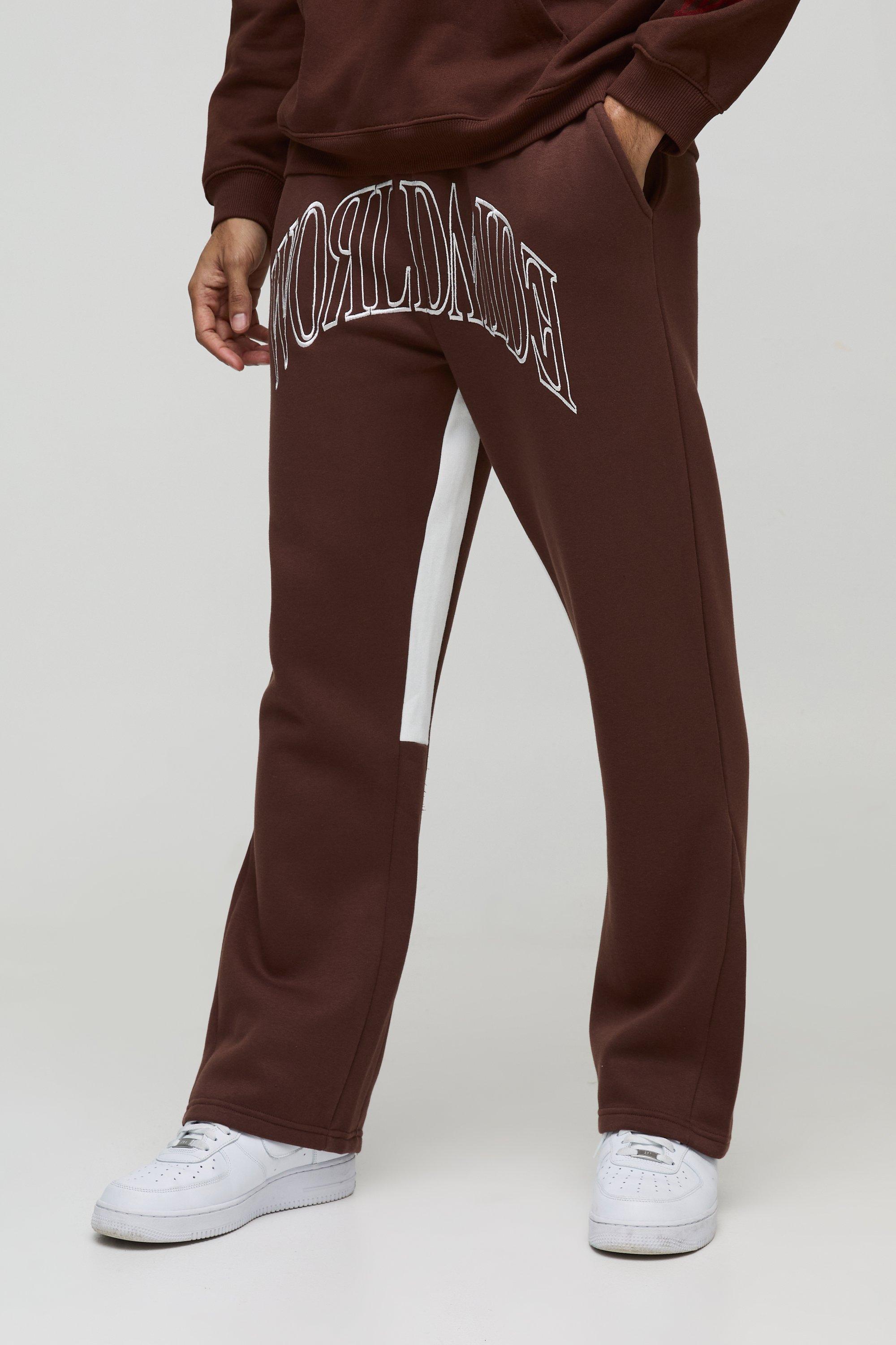 Pantaloni tuta Worldwide con cuciture a contrasto, ricami e inserti, Brown