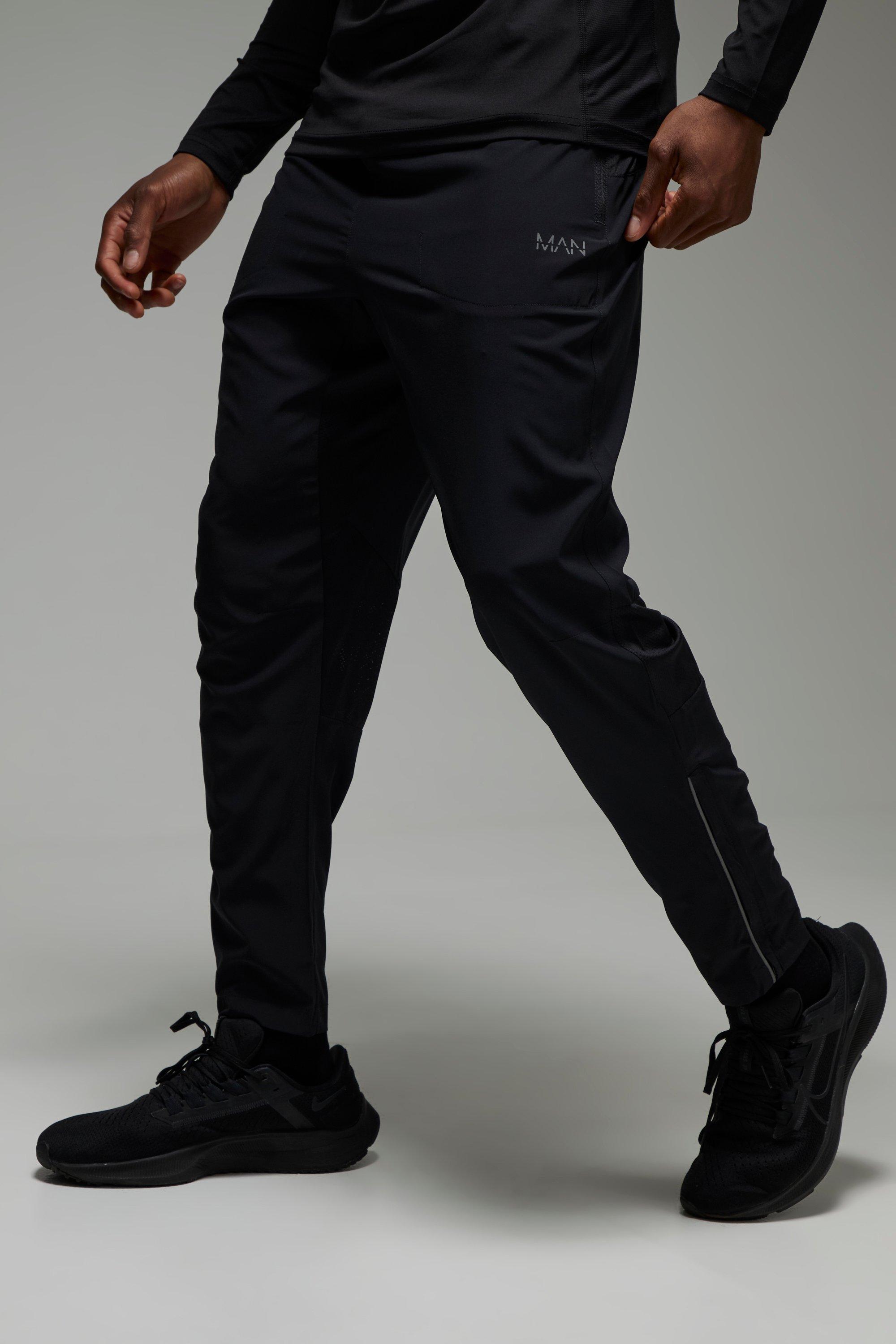 Pantaloni tuta Slim Fit Man Active leggeri in tessuto Stretch con zip sul fondo, Nero