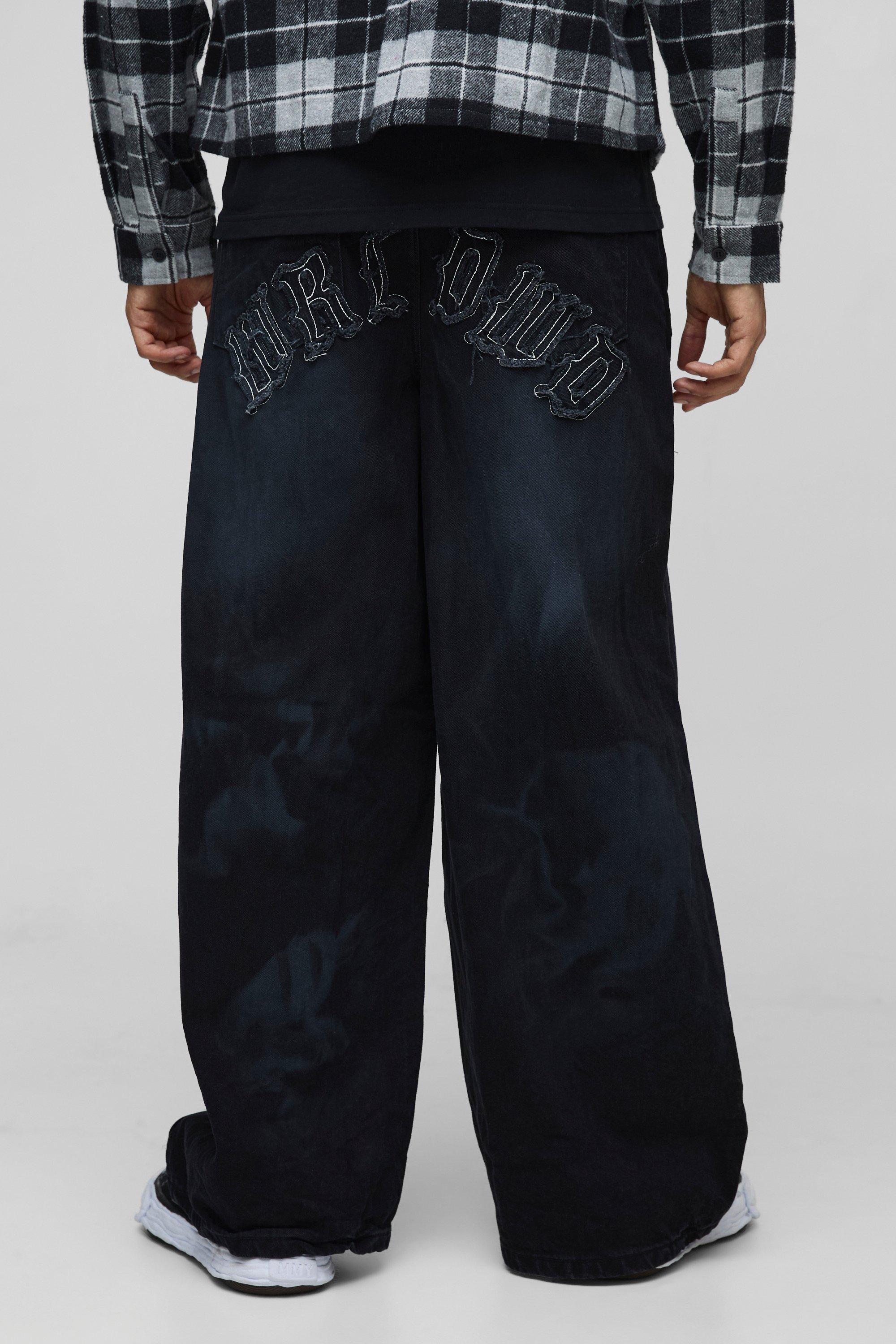 Jeans super extra comodi in denim rigido slavato effetto goffrato con applique, Nero