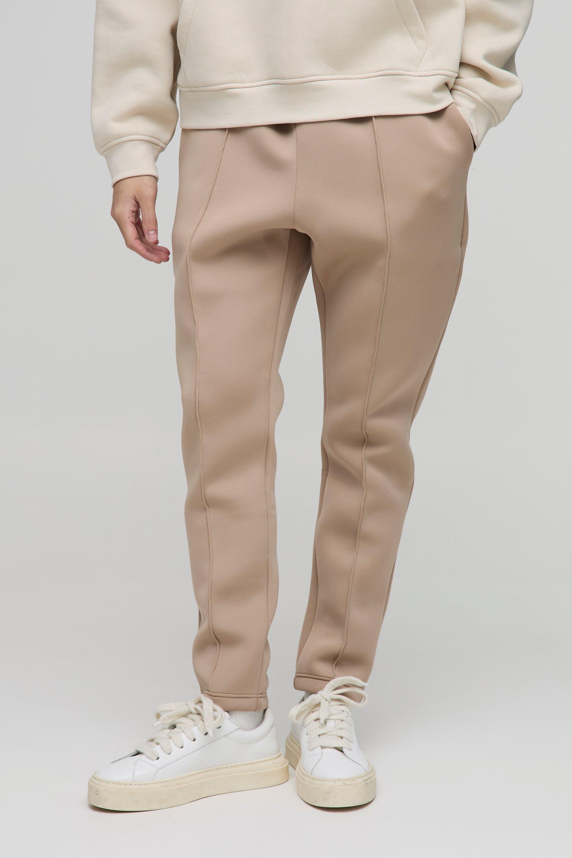 Image of Pantaloni tuta affusolati Slim Fit in Scuba rivestito, Beige