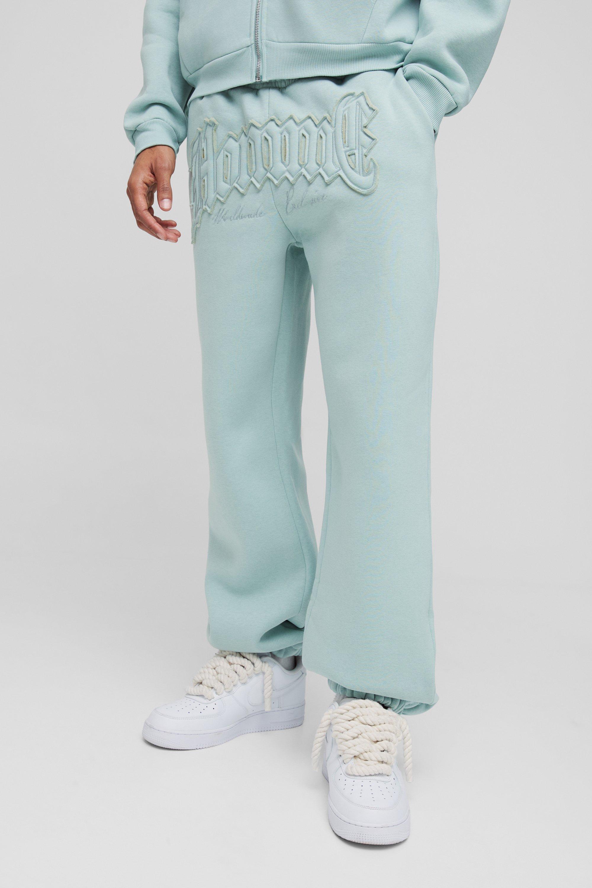 Pantaloni tuta oversize Homme con applique e polsini alle caviglie, Azzurro