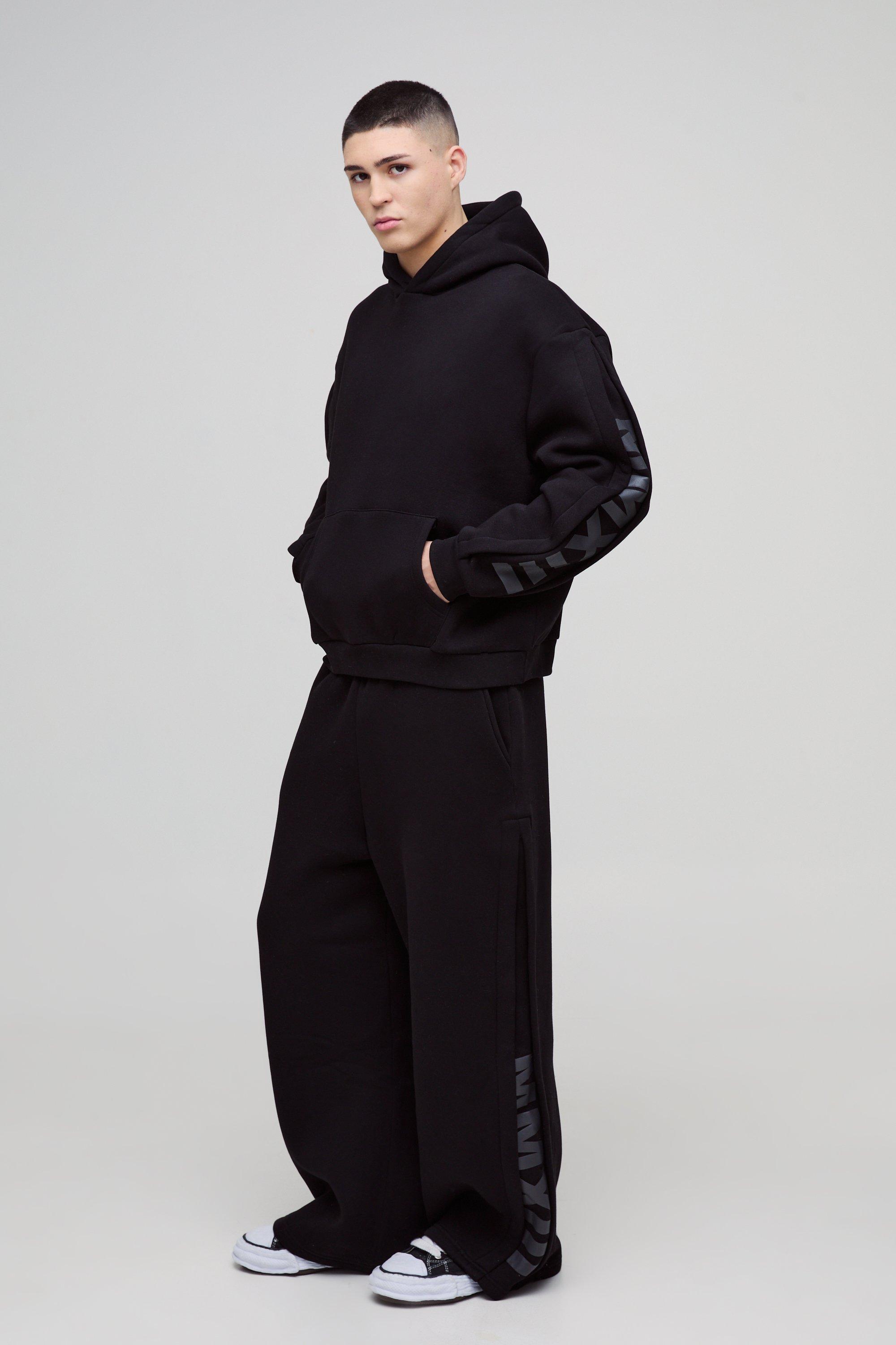 Tuta sportiva squadrata oversize con inserti a pieghe ampie e cappuccio, Nero