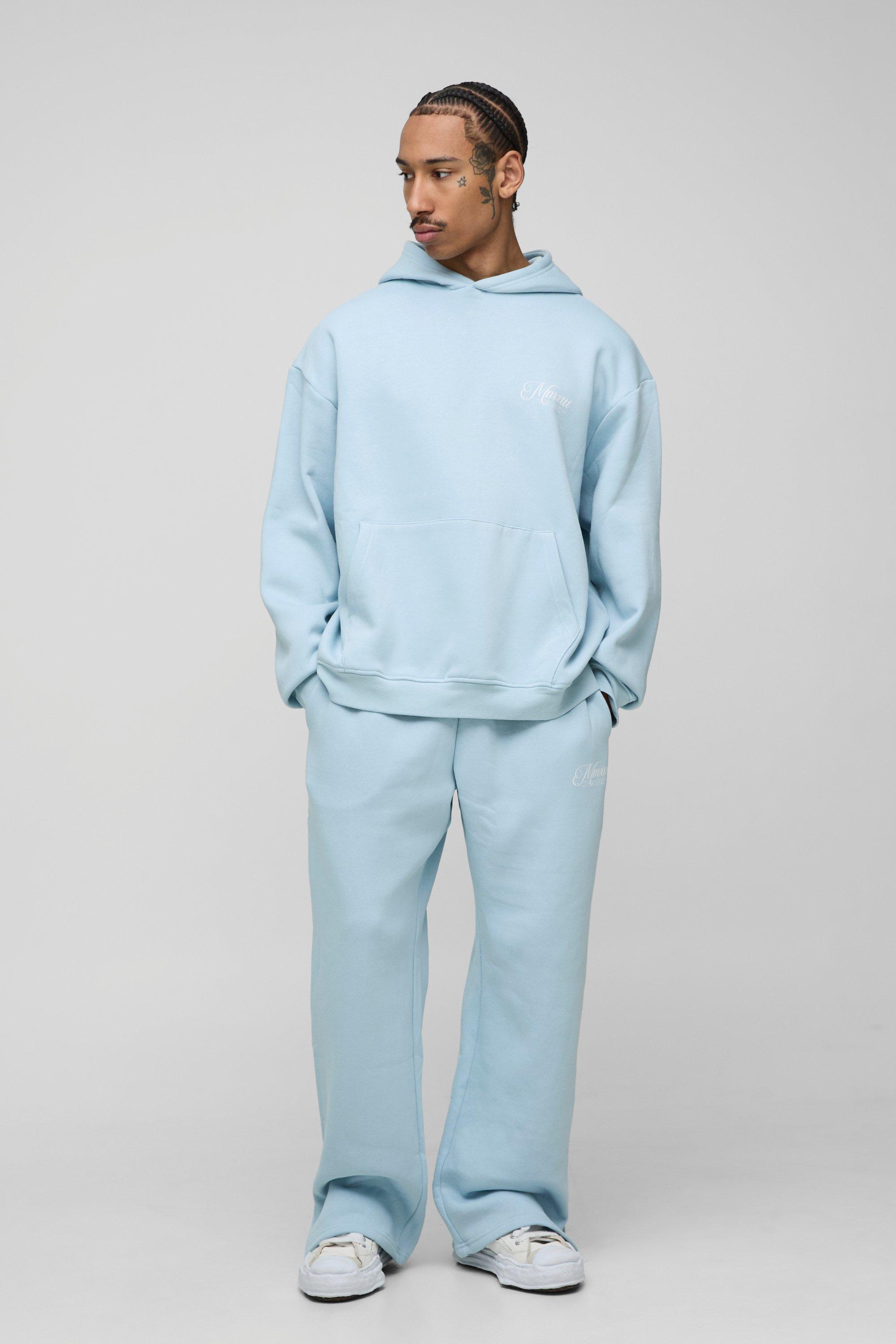 Image of Tuta sportiva oversize da 330 g/m² con scritta, cappuccio e spacco sul fondo, Azzurro