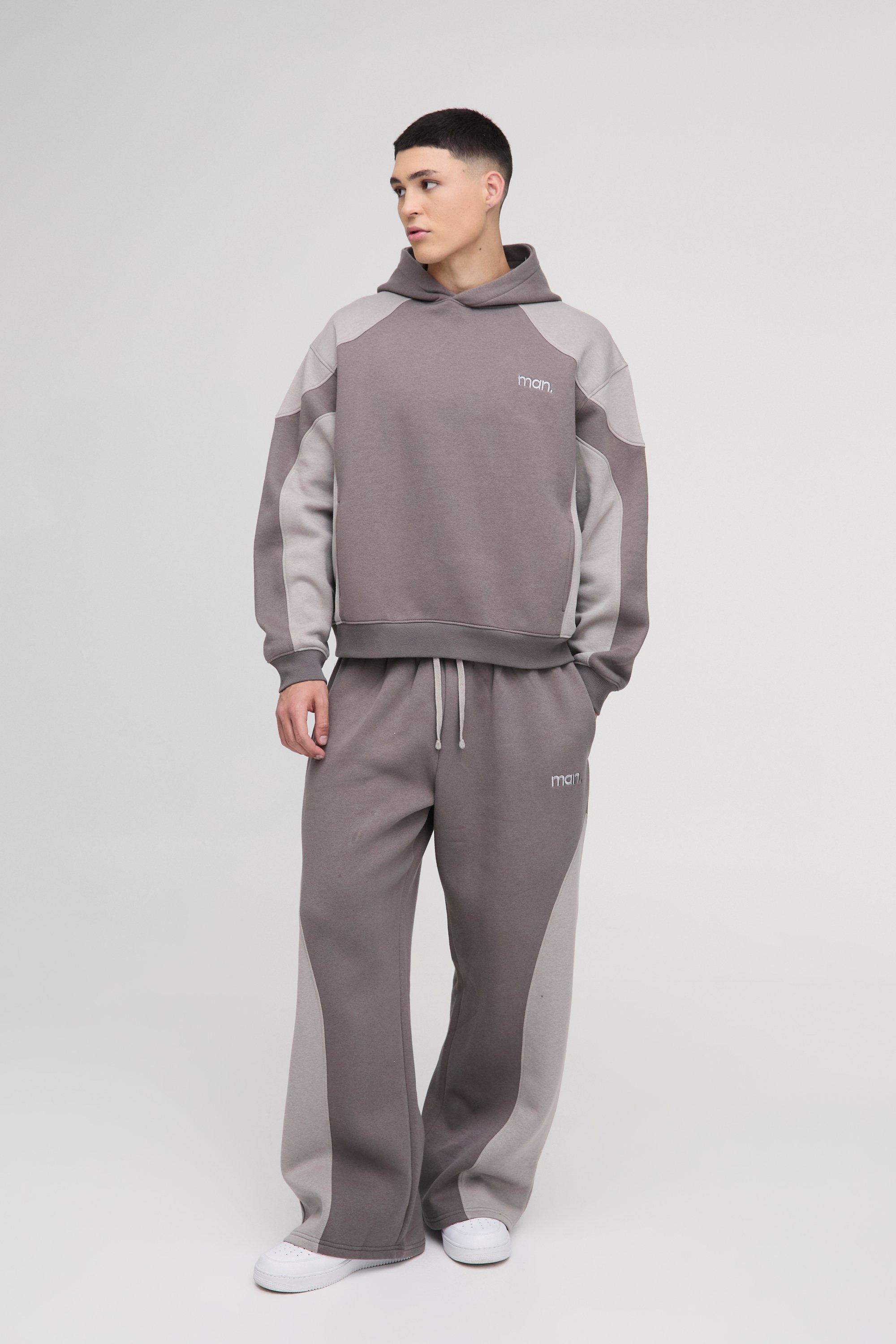 Tuta sportiva squadrata oversize Man con cuciture e cappuccio, Grigio