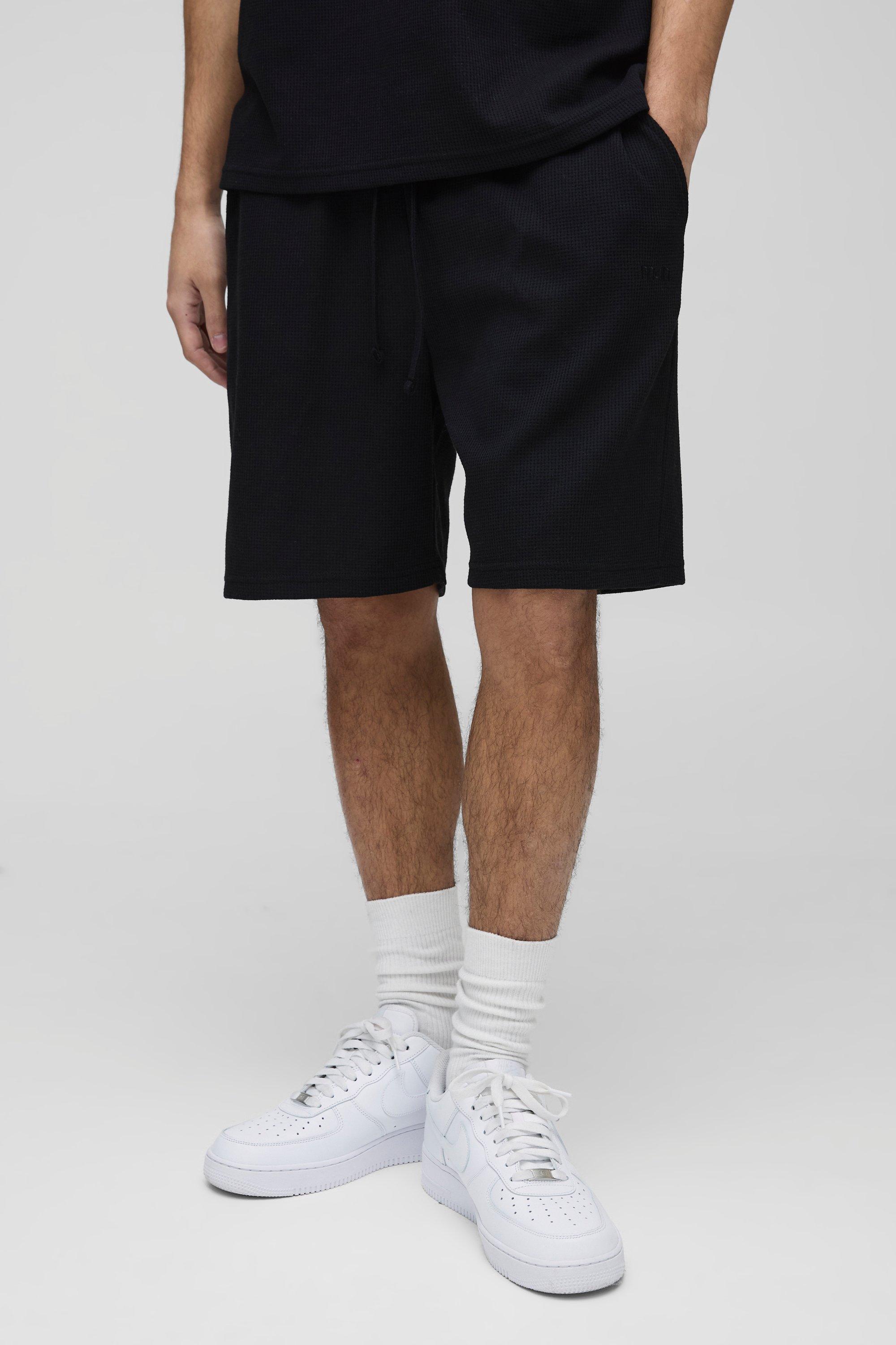 Pantaloncini rilassati con ricamo Man e trama a nido d'ape, Nero