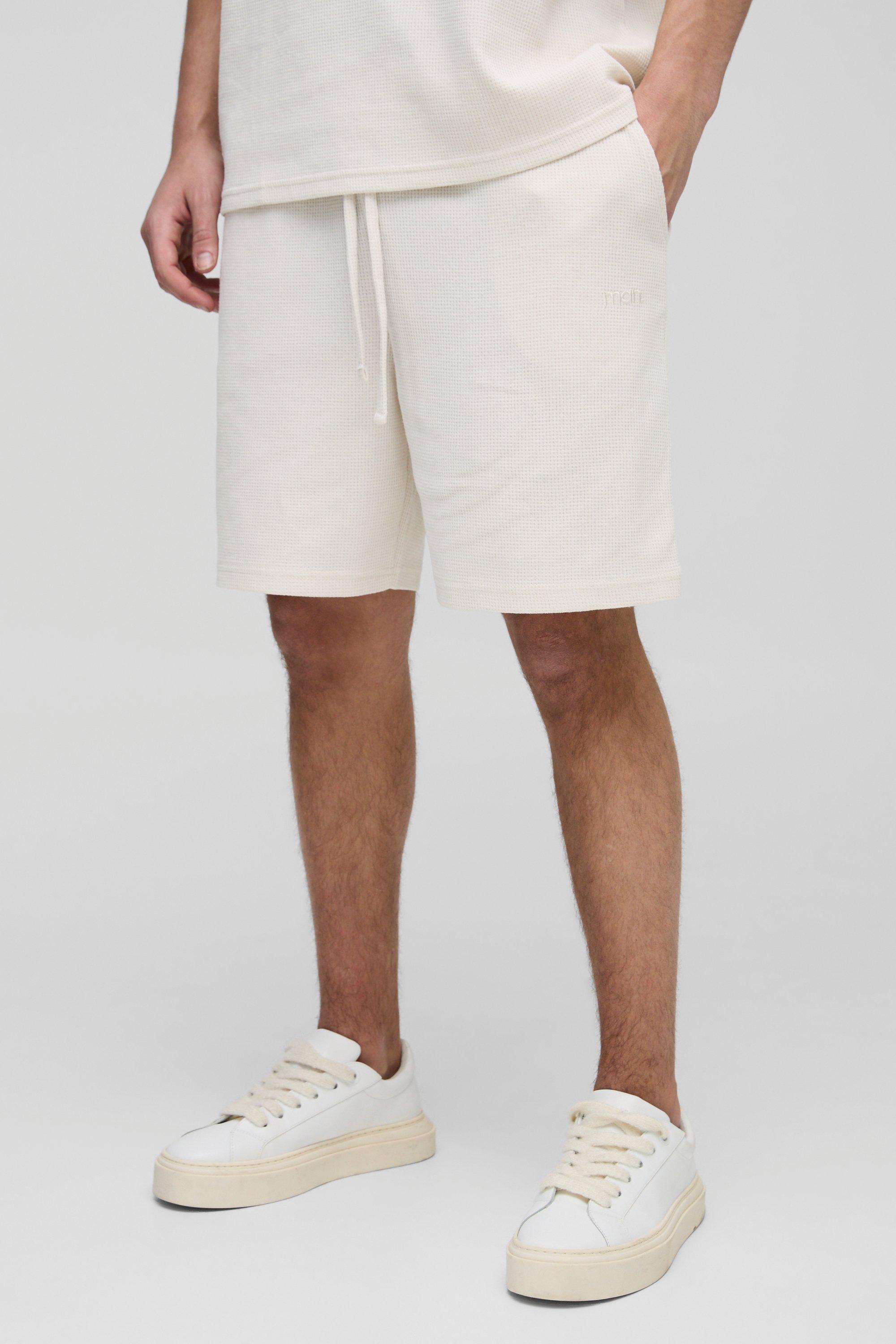 Pantaloncini rilassati con ricamo Man e trama a nido d'ape, Cream