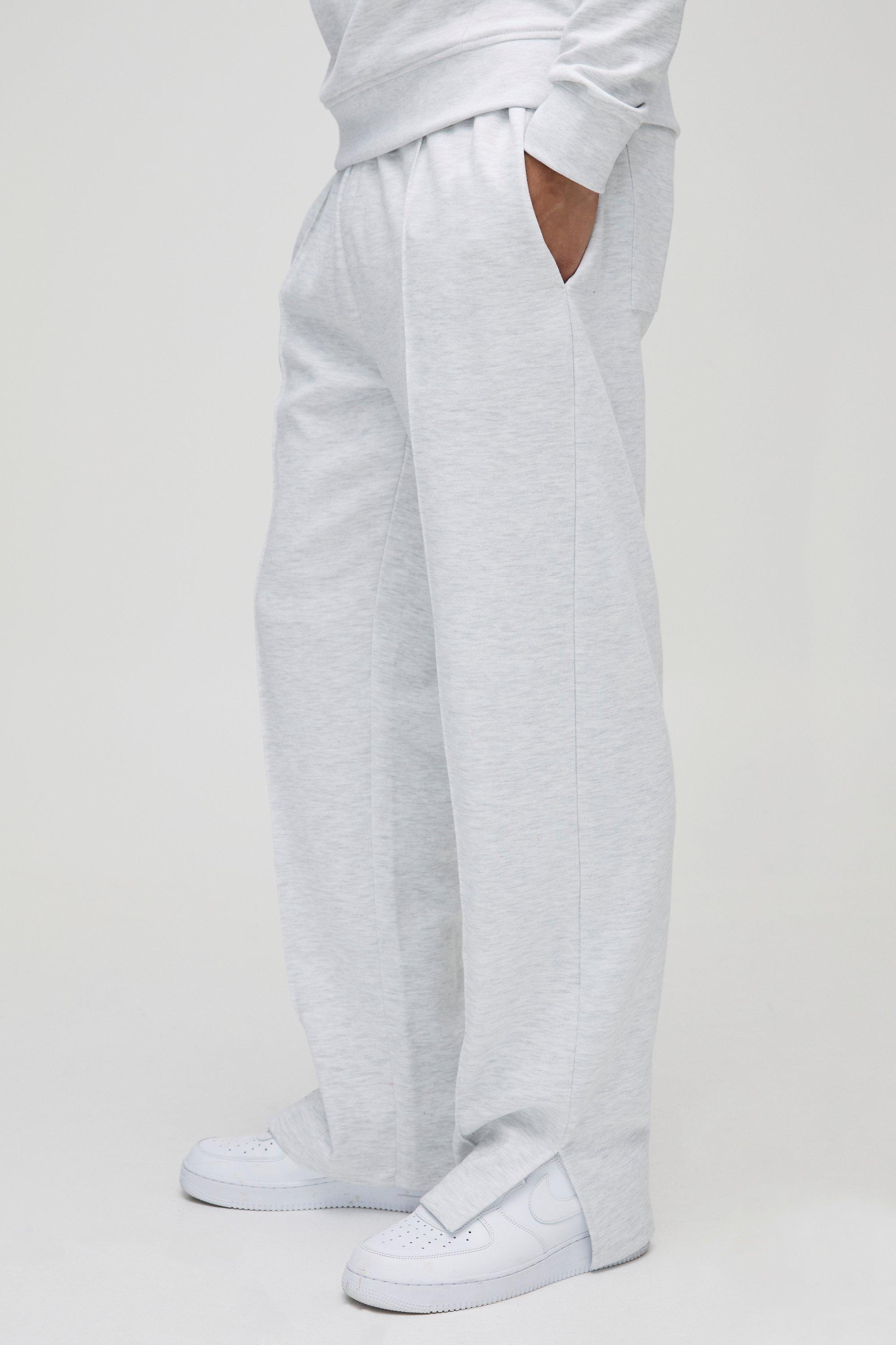 Image of Pantaloni tuta rilassati con nervature e spacco sul fondo, Grigio