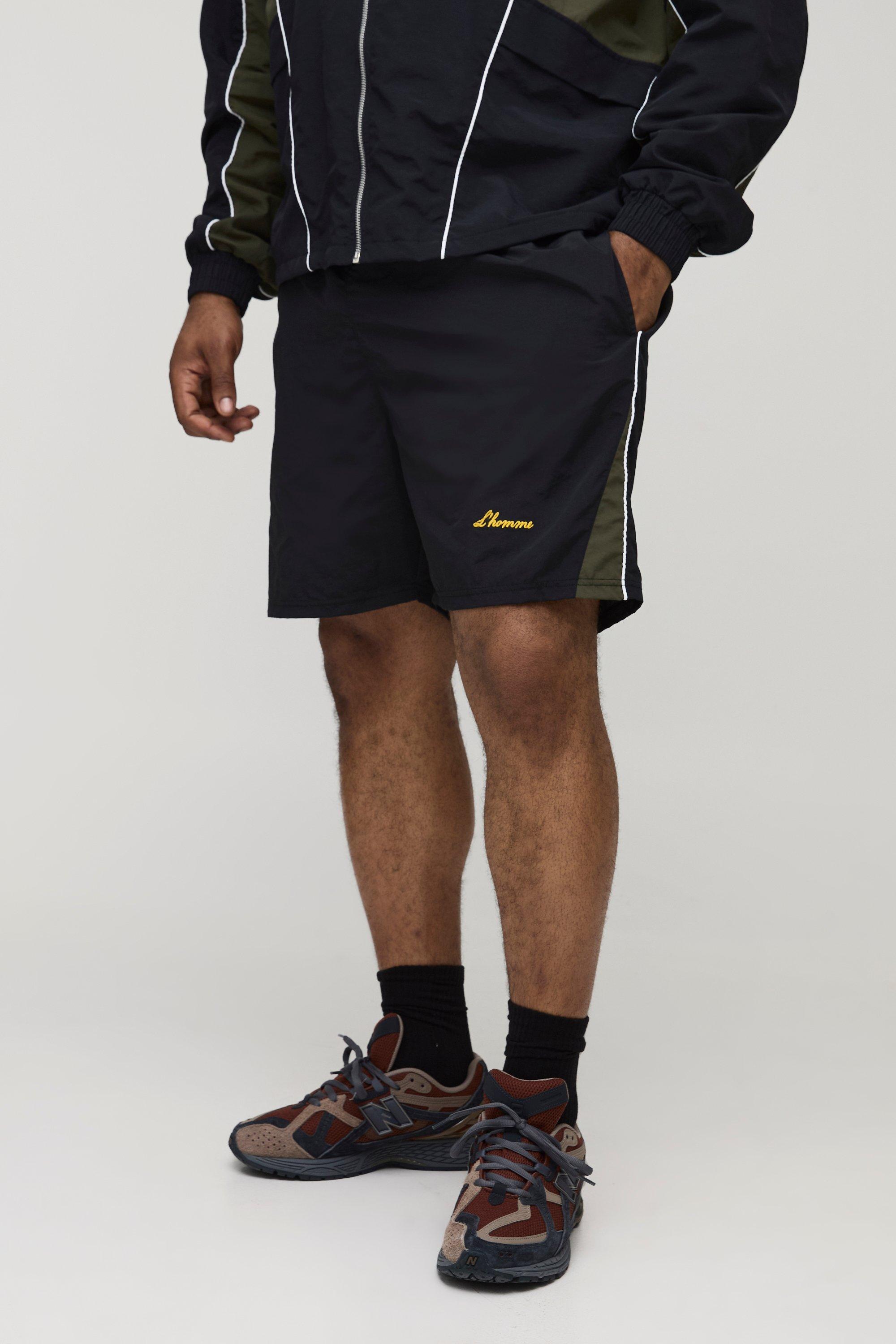 Image of Pantaloncini Plus Size in nylon effetto goffrato con pannelli, Nero