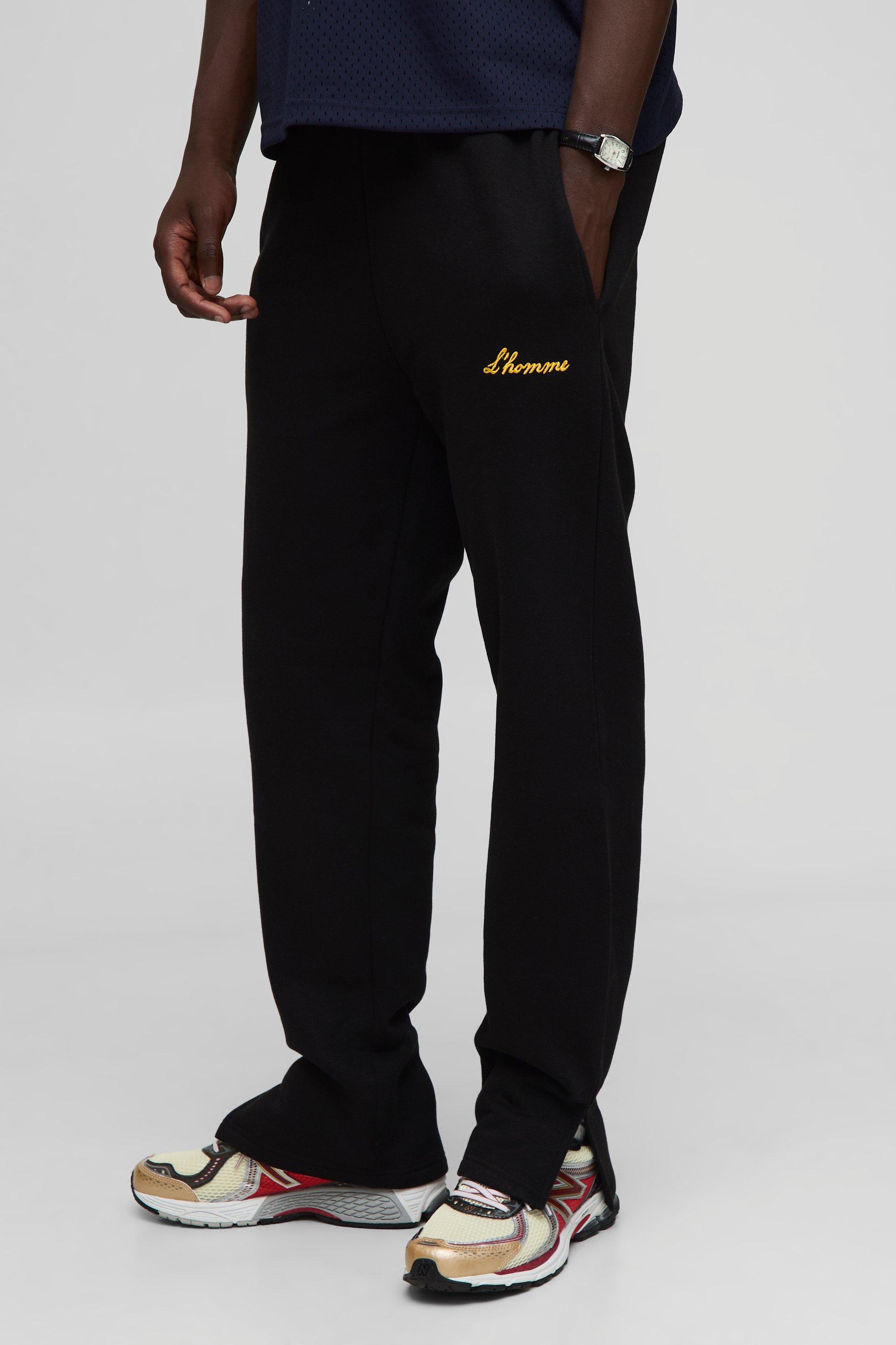 Image of Pantaloni tuta L'Homme con spacco sul fondo, Nero