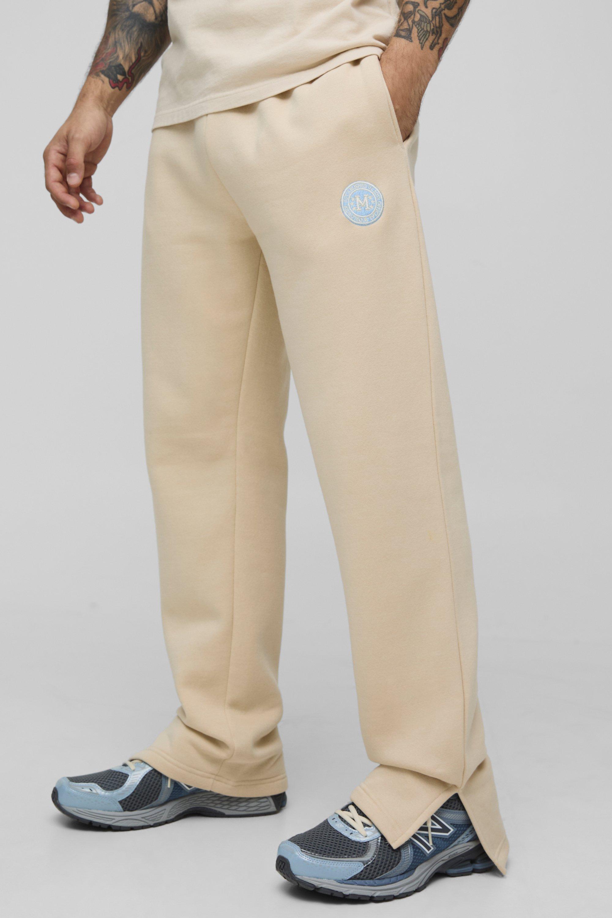 Image of Pantaloni tuta con ricami e spacco sul fondo, Cream