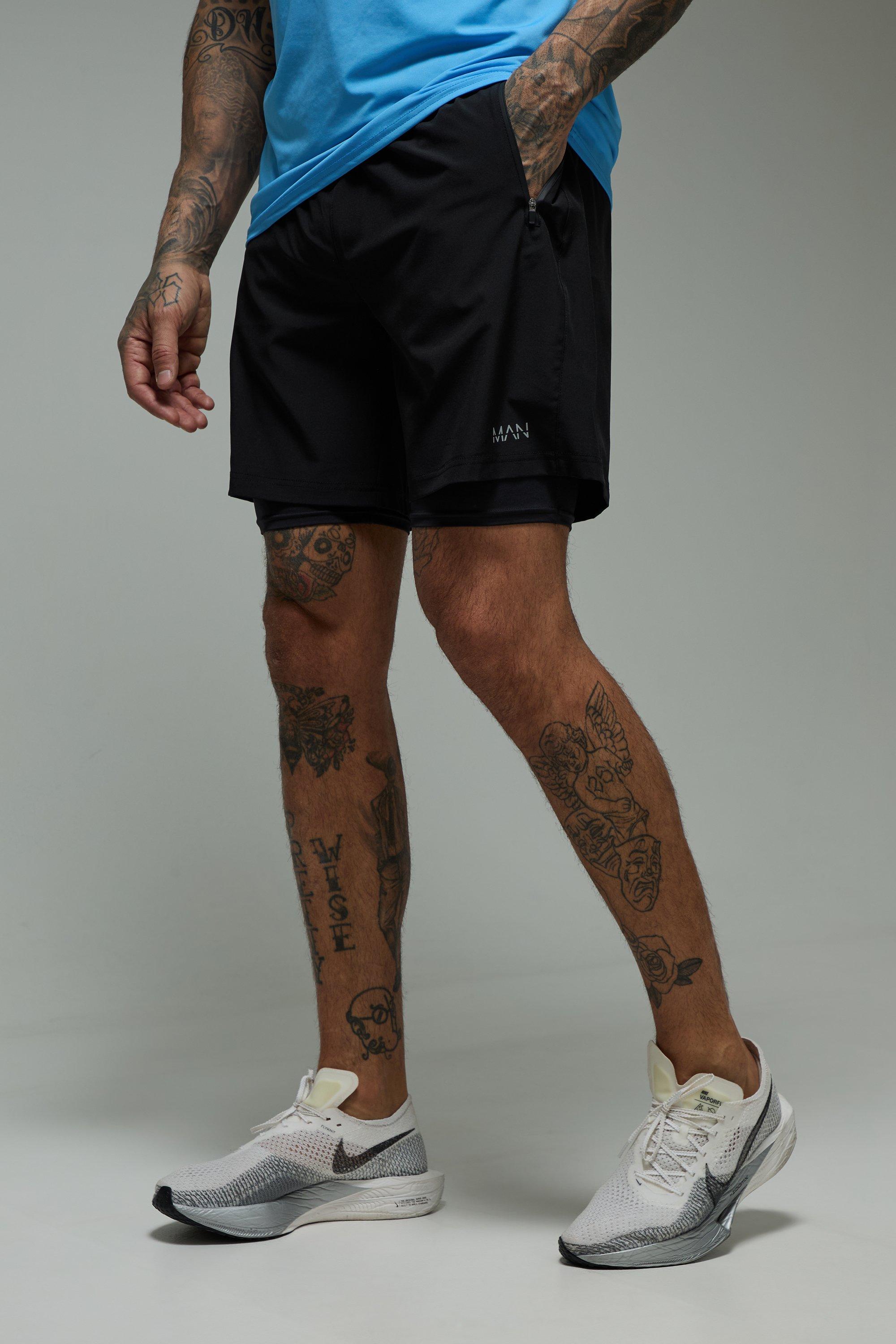 Image of Pantaloncini 2 in 1 Tall Man Active in tessuto Stretch da 7 pollici, Nero