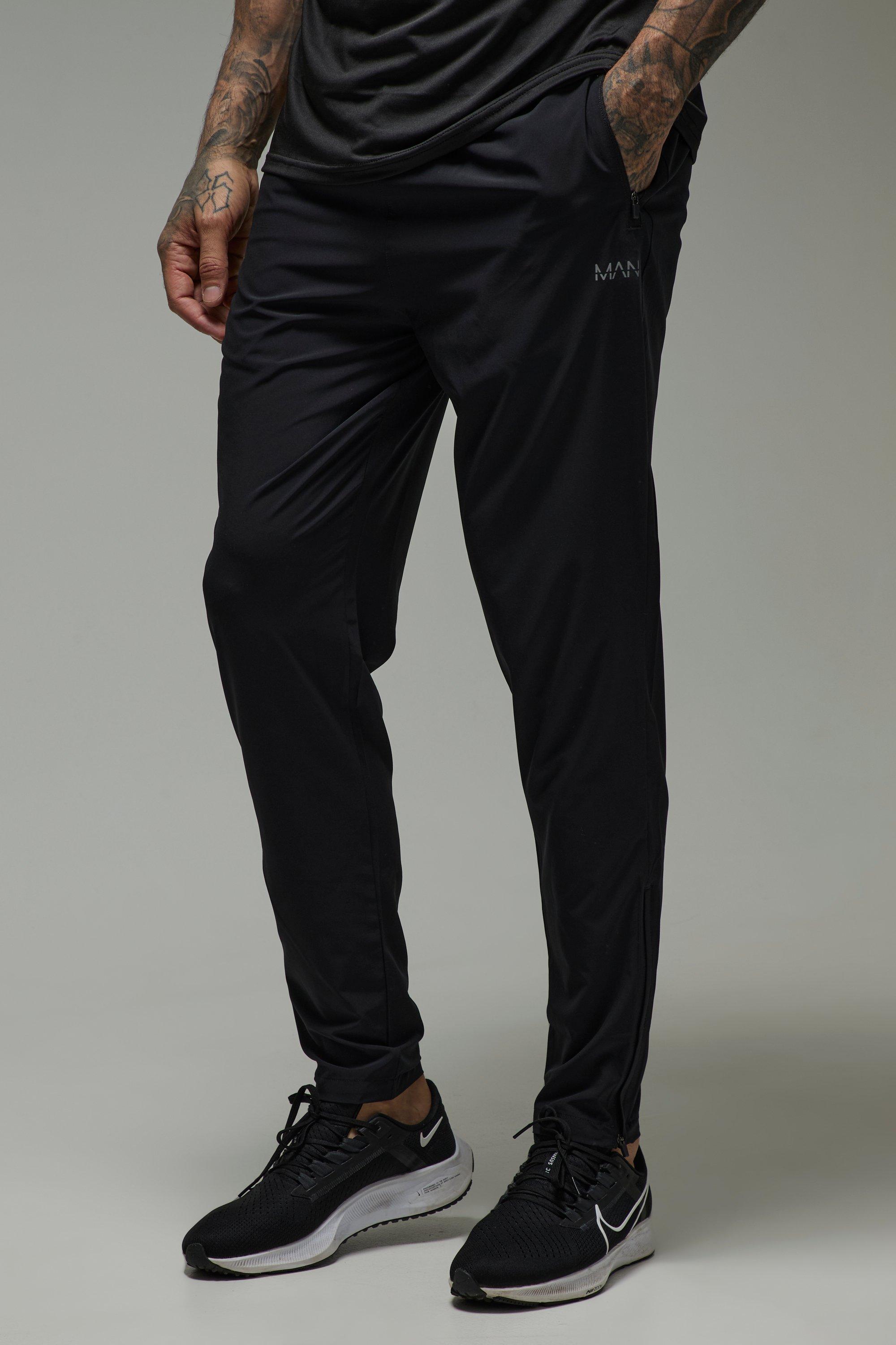 Image of Pantaloni tuta affusolati Tall Man Active per alta performance in tessuto Stretch leggero, Nero