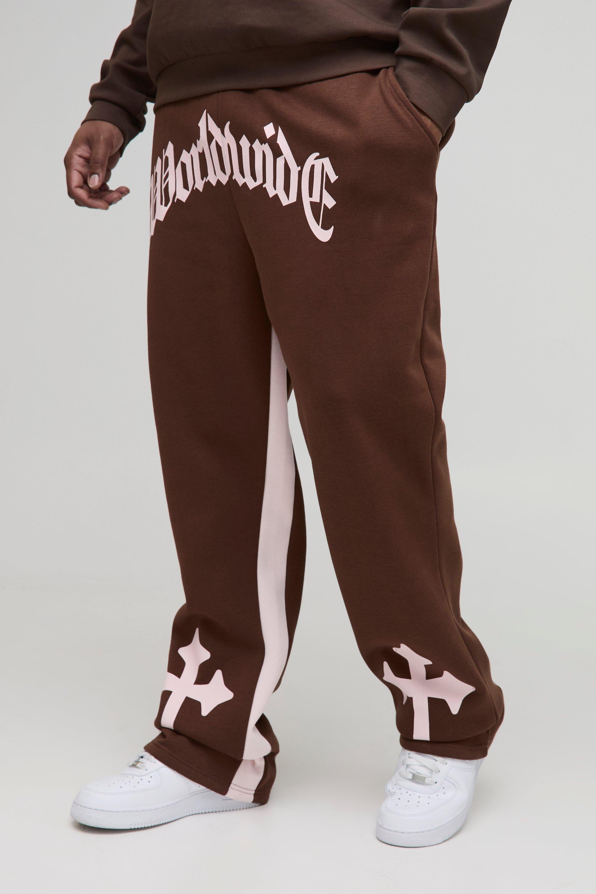 Image of Pantaloni tuta Plus Size Worldwide con stampa a croce, inserti a zampa, Brown