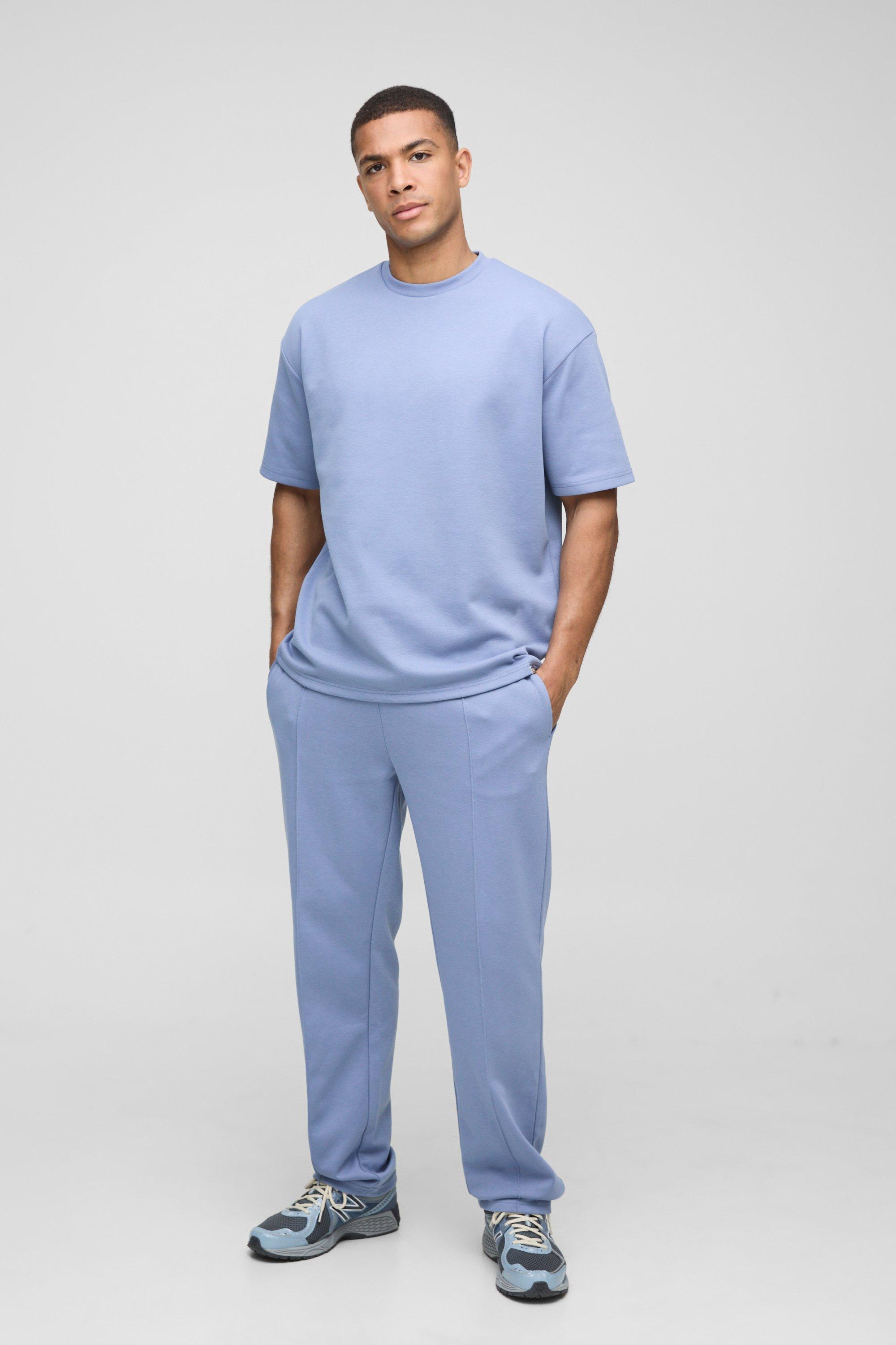 Image of Tuta sportiva oversize con T-shirt intrecciata & pantaloni tuta, Azzurro
