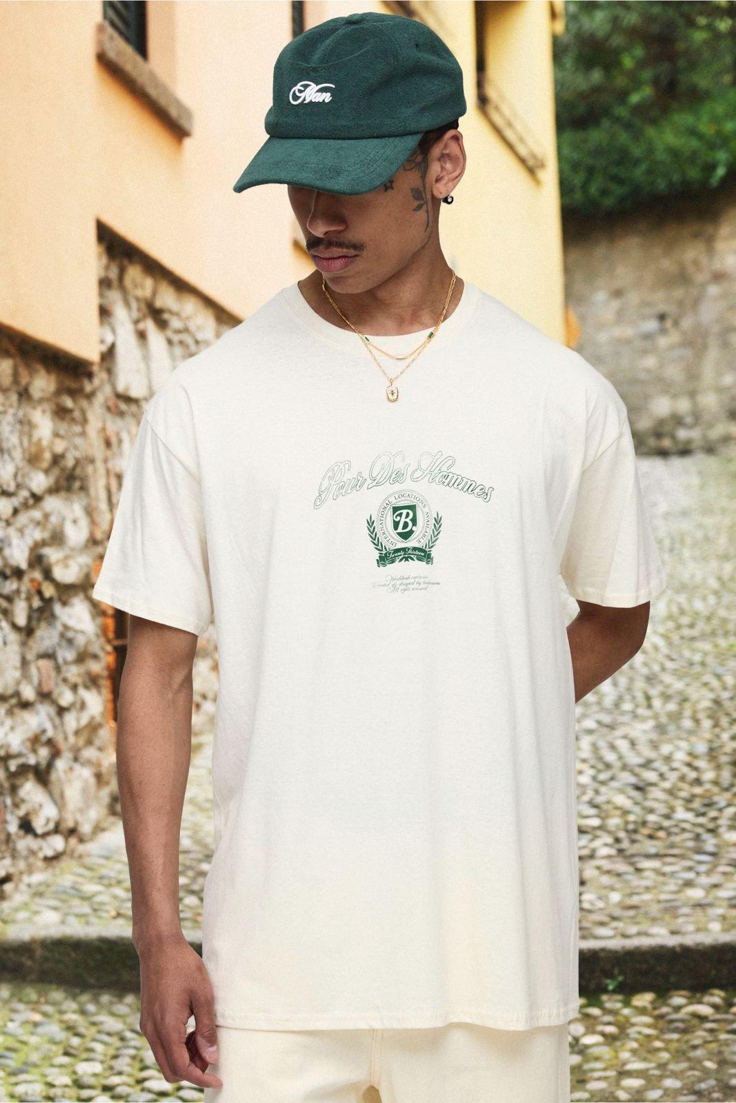 Image of T-shirt oversize color ecru con stampa Pour Homme e girocollo esteso, Cream